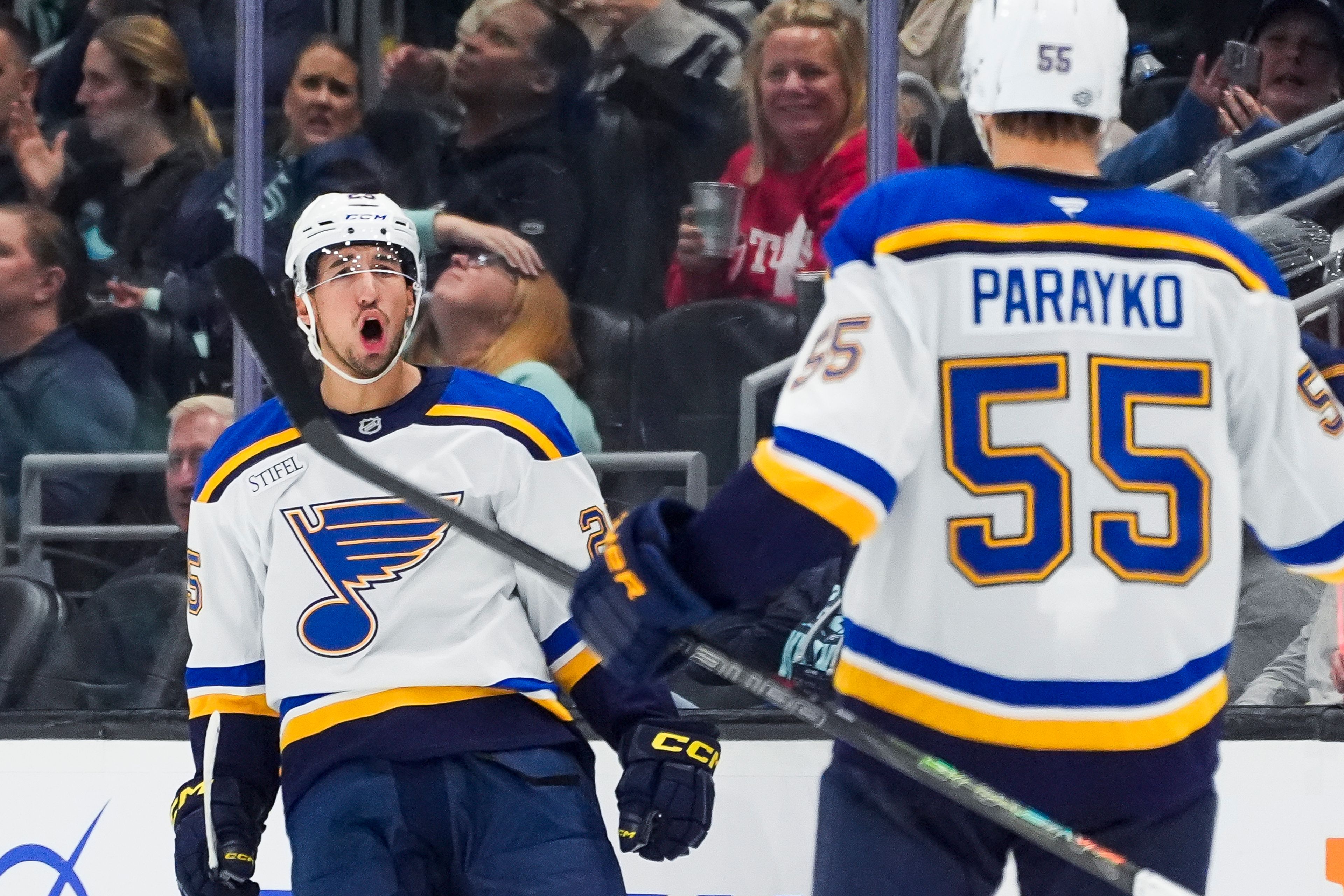 St. Louis Blues center Jordan Kyrou, left, celebrates his second goal of the game against the Seattle Kraken with defenseman Colton Parayko (55) during the second period of an NHL hockey game Tuesday, Oct. 8, 2024, in Seattle. The Blues won 3-2. (AP Photo/Lindsey Wasson)