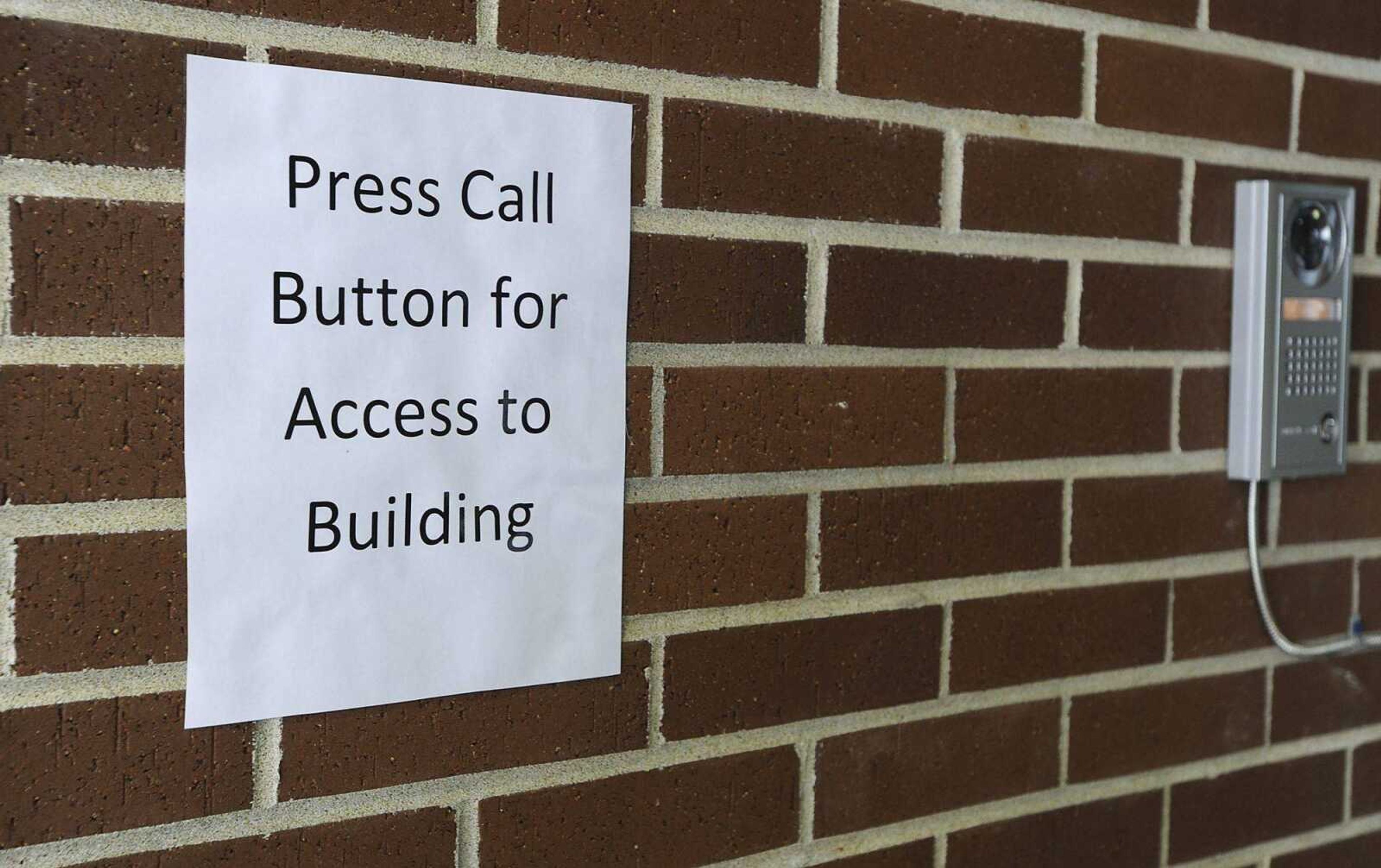 A camera and intercom system, Tuesday, Feb. 26, at the front entrance of South Elementary School in Jackson. Anyone wanting to enter the building must identify themselves before being allowed in. (ADAM VOGLER)