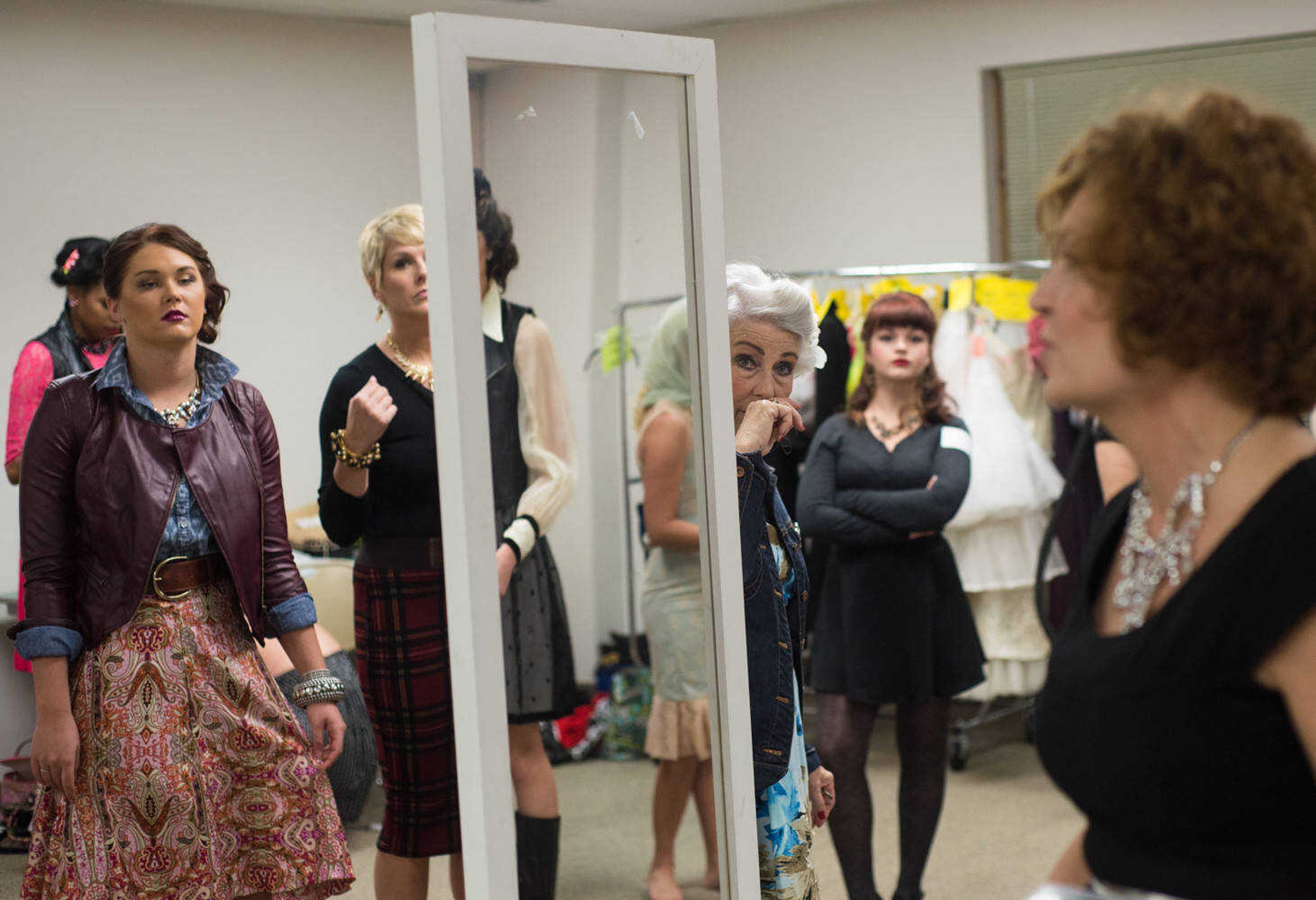 AARON EISENHAUER ~ photos@semissourian.com
Models prepare for the start of the fifth annual VintageNOW fashion show, a fundraiser for Safe House for Women, at the Osage Centre on Friday, October 17, 2014.