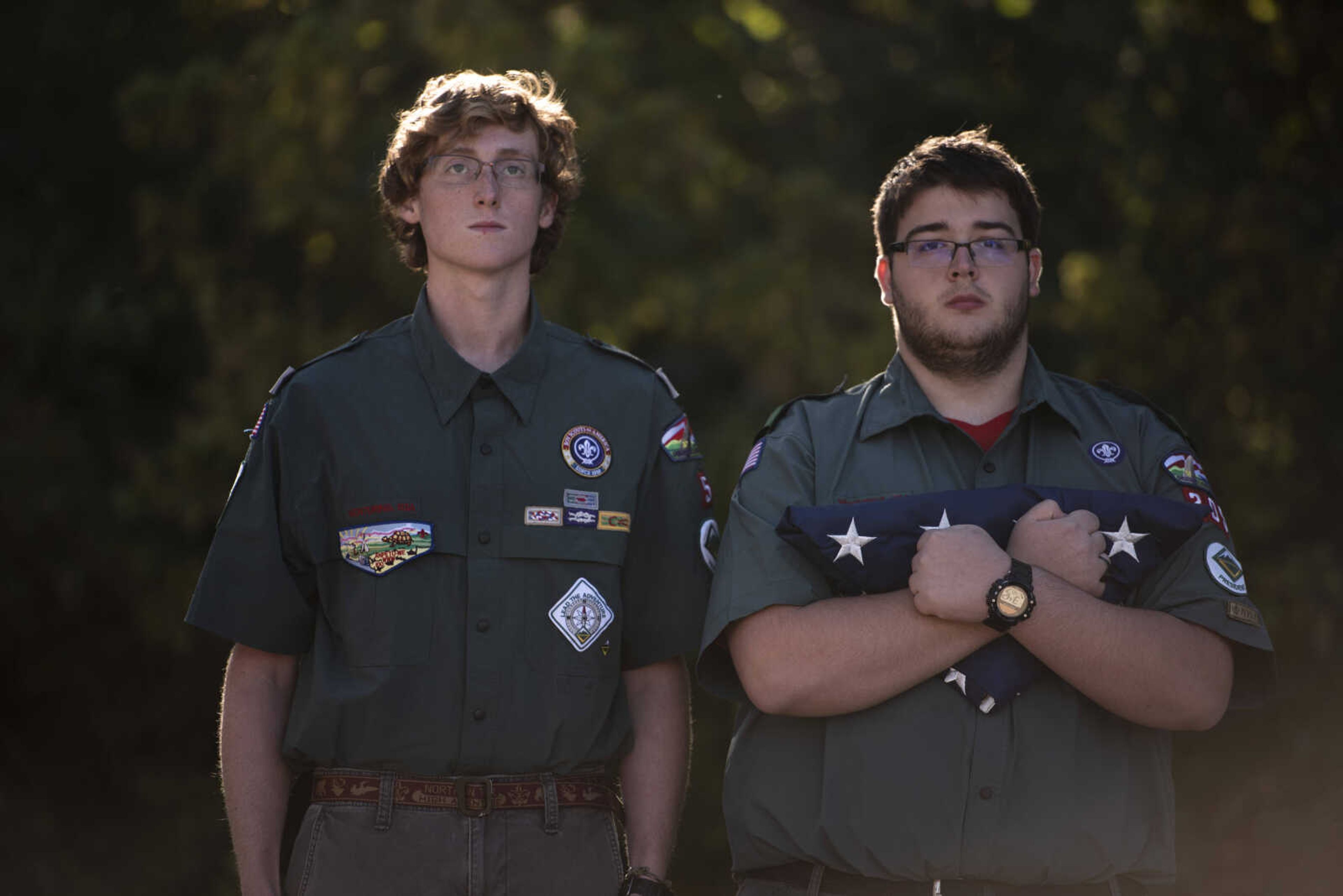 Venture Crew 4005 members Dom Unterreiner, left, and Jacob Homer, right, participate in the inaugural flag retirement ceremony at VFW Post 3838 Sunday, Oct. 21, 2018, in Cape Girardeau.