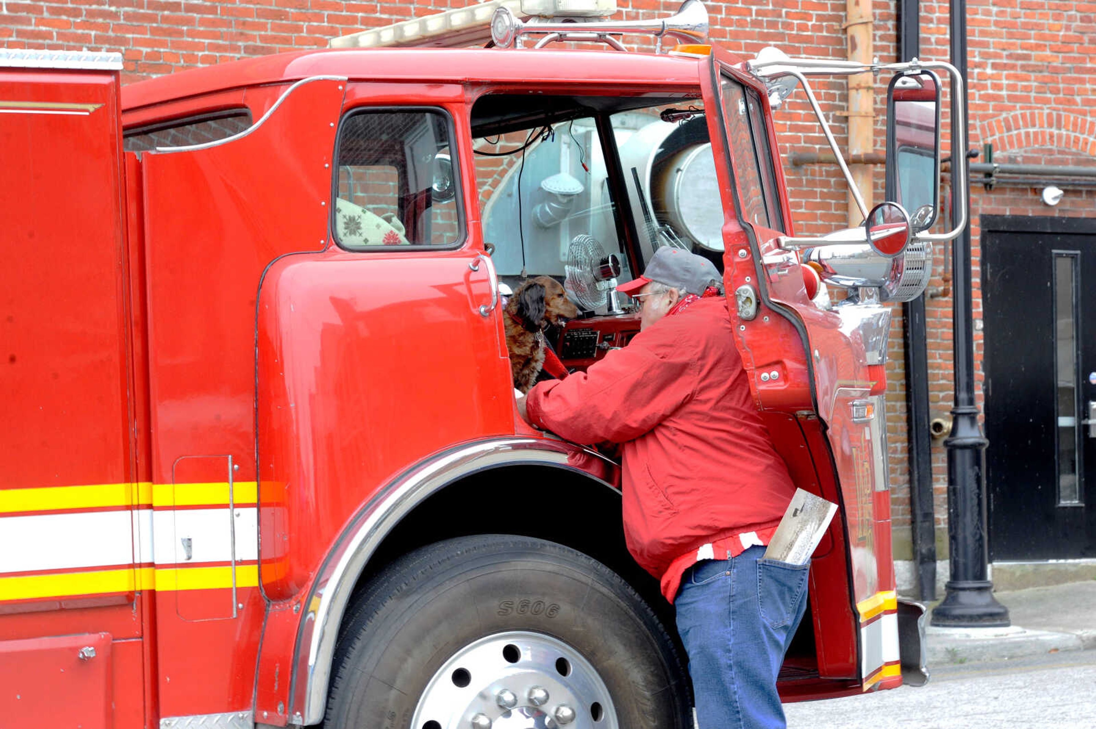 Joe Thompson, a collector of out-of-service firetrucks, and his dog, Gadget, brought the newest addition to his collection вЂ” a firetruck from West Plains, Missouri вЂ” to display at WaterFest on Saturday, Oct. 24, 2020. Thompson checks in on Gadget, who spent most of WaterFest inside the firetruck after becoming too cold and shivering outside, periodically throughout the event, held by the Kellerman Foundation for Historic Preservation in the parking lot at the corner of Themis and Water St. in downtown Cape Girardeau.