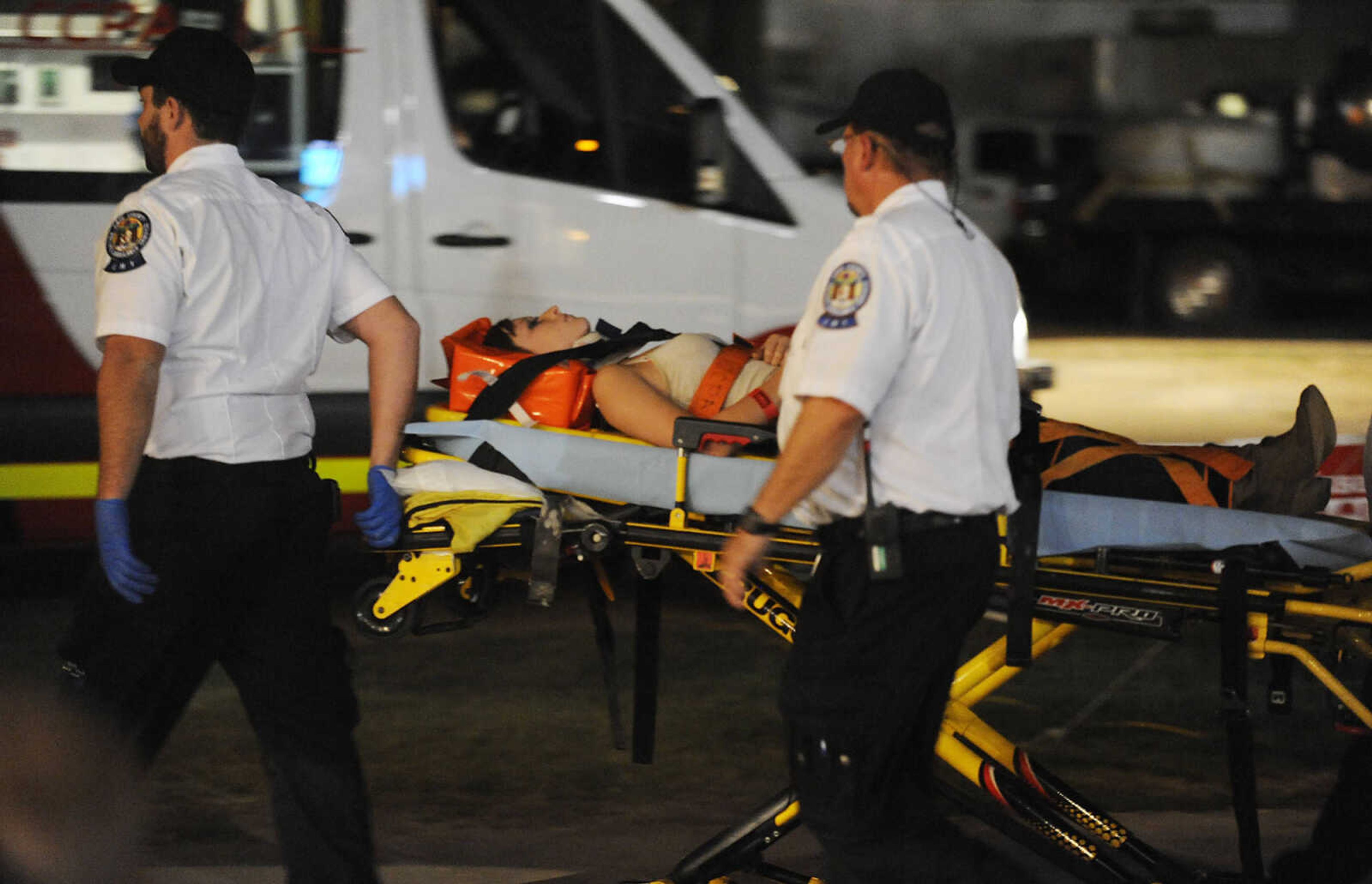 Leslie Welker is loaded into an ambulance after being injured during the Dual Demo Derby at the SEMO District Fair Tuesday, September 11, at Arena Park in Cape Girardeau. Just seconds into their heat driver Mark Mayfield and Welker's car was disabled and Welker was injured.