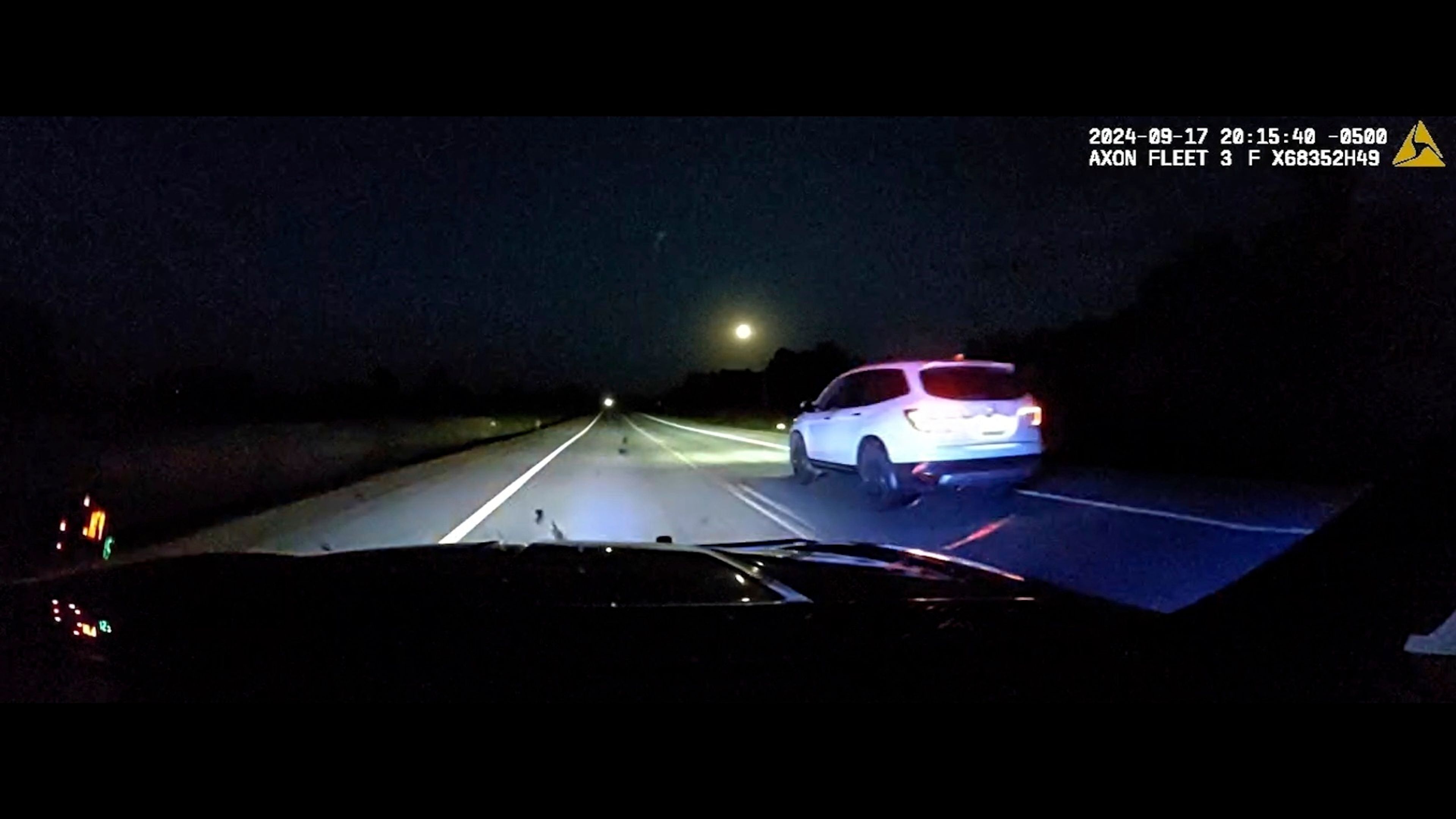 This image taken from police dash camera footage provided by the Minnesota State Patrol, shows a Minnesota trooper passing 18-year-old Sam Dutcher after the Honda Pilot he was driving began to accelerate over 100 miles per hour in western Minnesota on Tuesday, Sept. 17, 2024. The brakes and would not work and the vehicle would not shift into neutral. A trooper managed to speed in front of the Honda and told Sam by phone to crash into the rear of his squad car, allowing it to ease safely to a stop. (Minnesota State Patrol via AP)