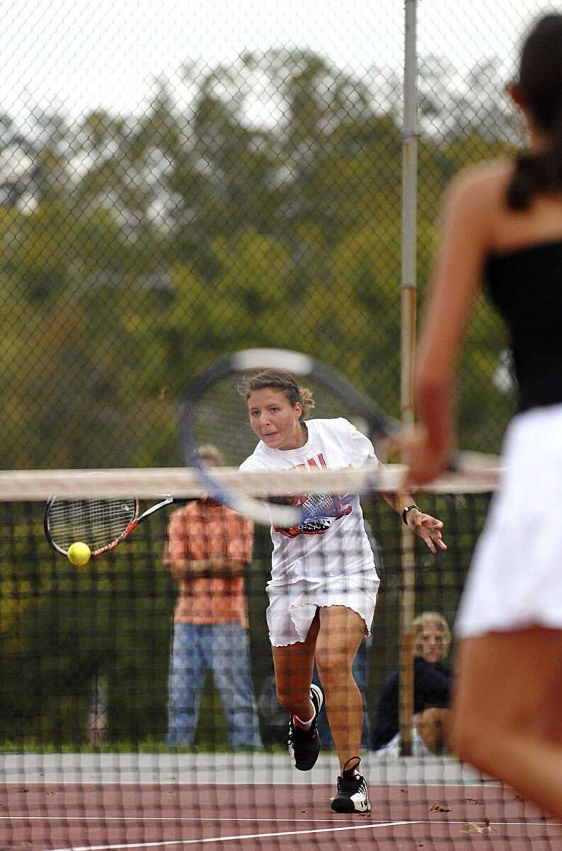 AARON EISENHAUER ~ aeisenhauer@semissourian.com
Central's Kristi Lazarova returns the ball Wednesday during a doubles match against Jackson's Alison Keiper and Erinne Haff at the Jackson tennis courts.