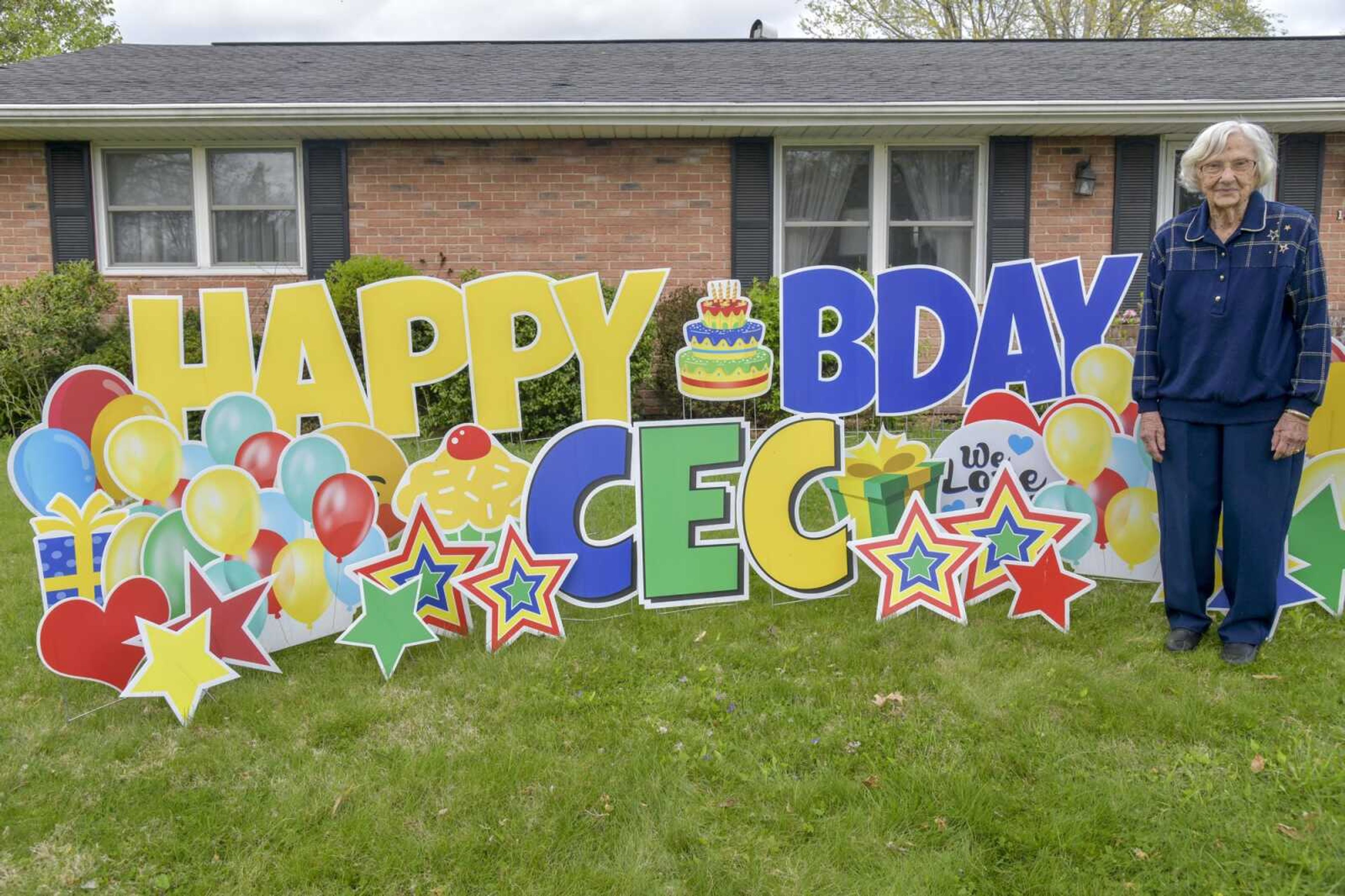 Cecil Beal commemorates her 100th birthday with a sign on her lawn Wednesday in Cape Girardeau. Beal turned 100 years old Wednesday and said she is unsure who put the sign there. "I feel the same as I did when I was 50," Beal said. "I still mow the yard and do what needs to be done."