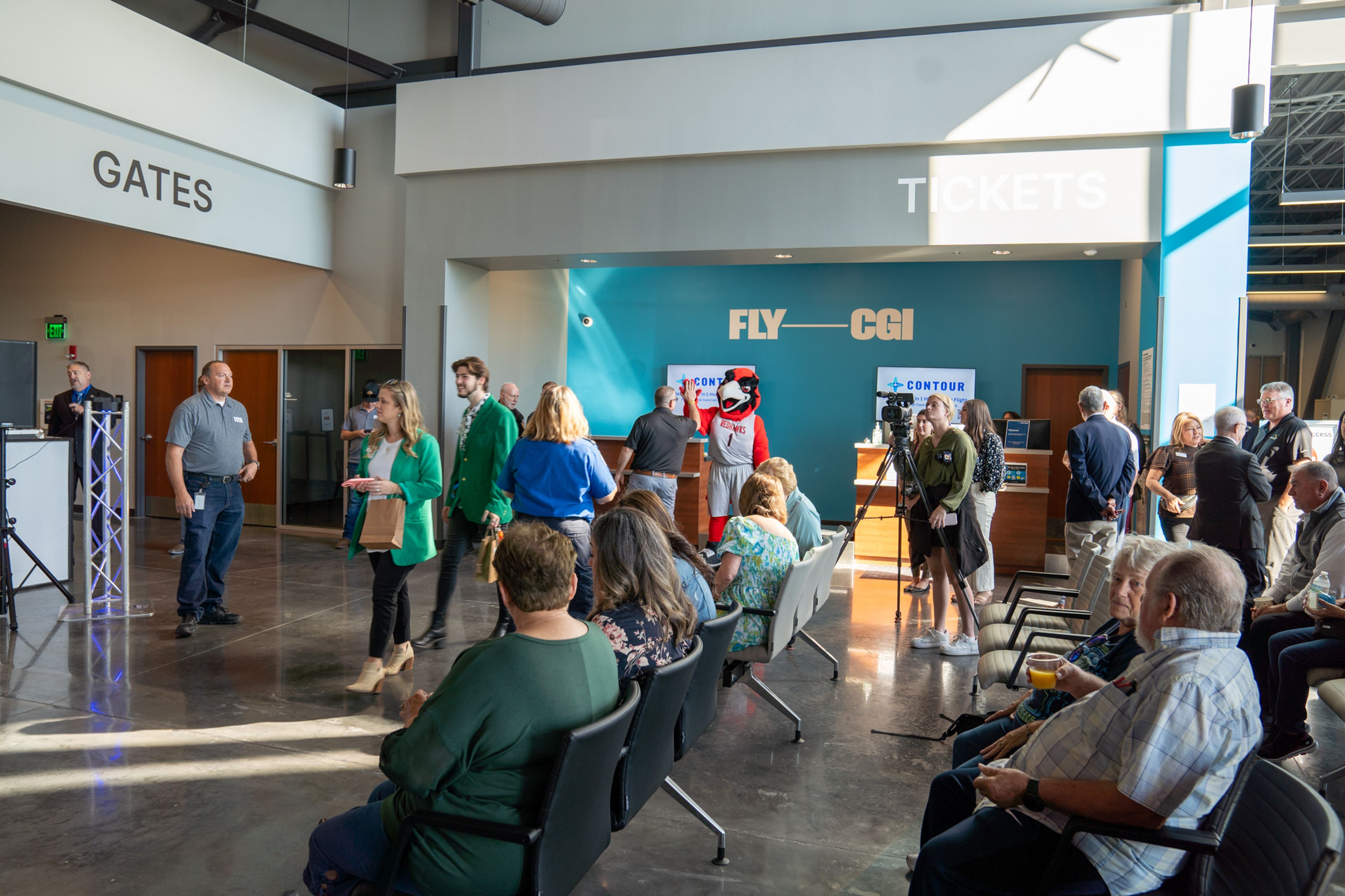 A crowd gathers in the new Cape Girardeau Regional Airport Terminal for the news conference and ribbon-cutting Tuesday, Oct. 1, in Cape Girardeau.