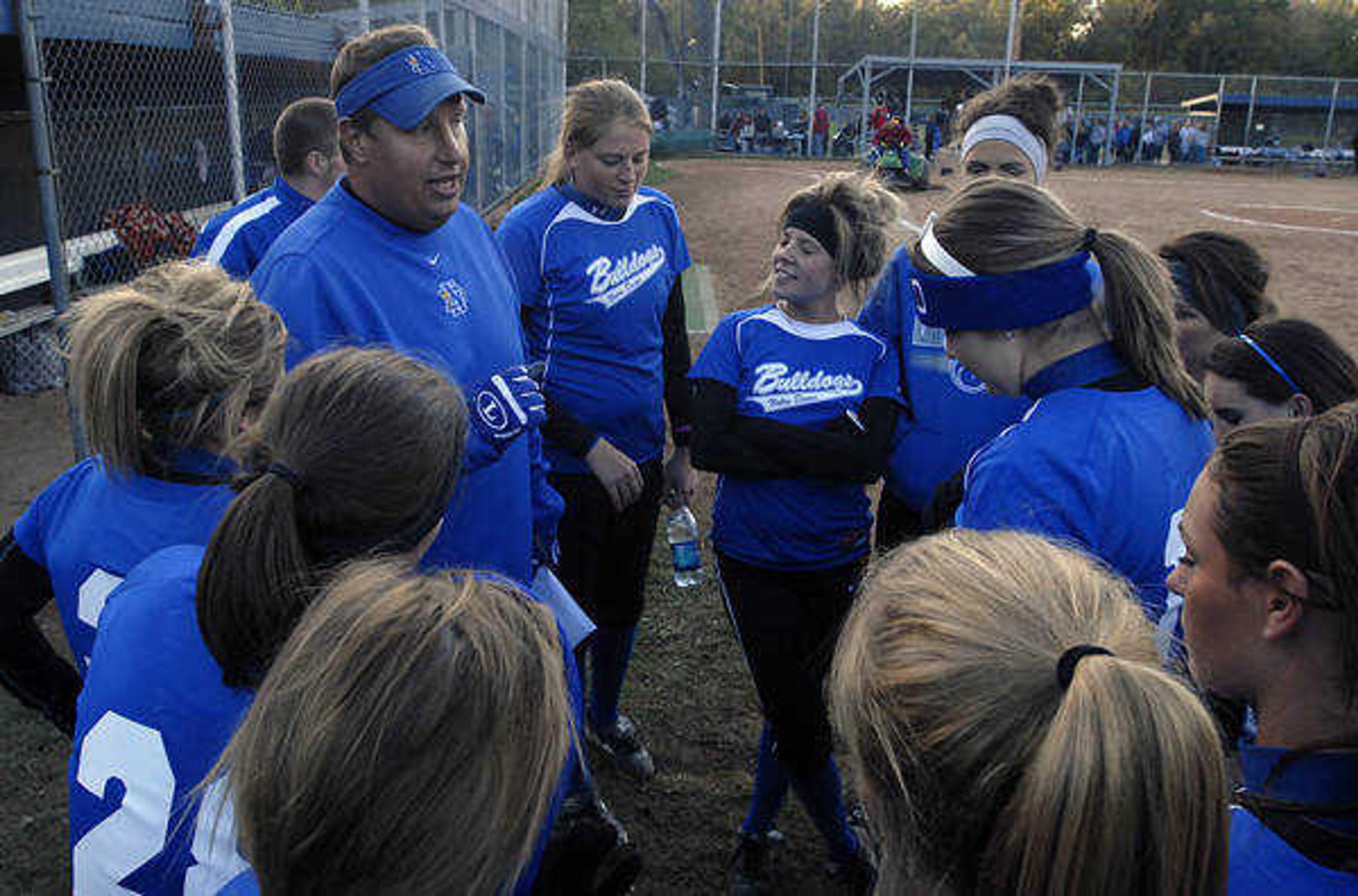 KIT DOYLE ~ kdoyle@semissourian.com
Head coach Jeff Graviett congratulates the Bulldogs on their 6-0 quarterfinal win over Kennedy Saturday afternoon, October 17, 2009, in Ballwin.