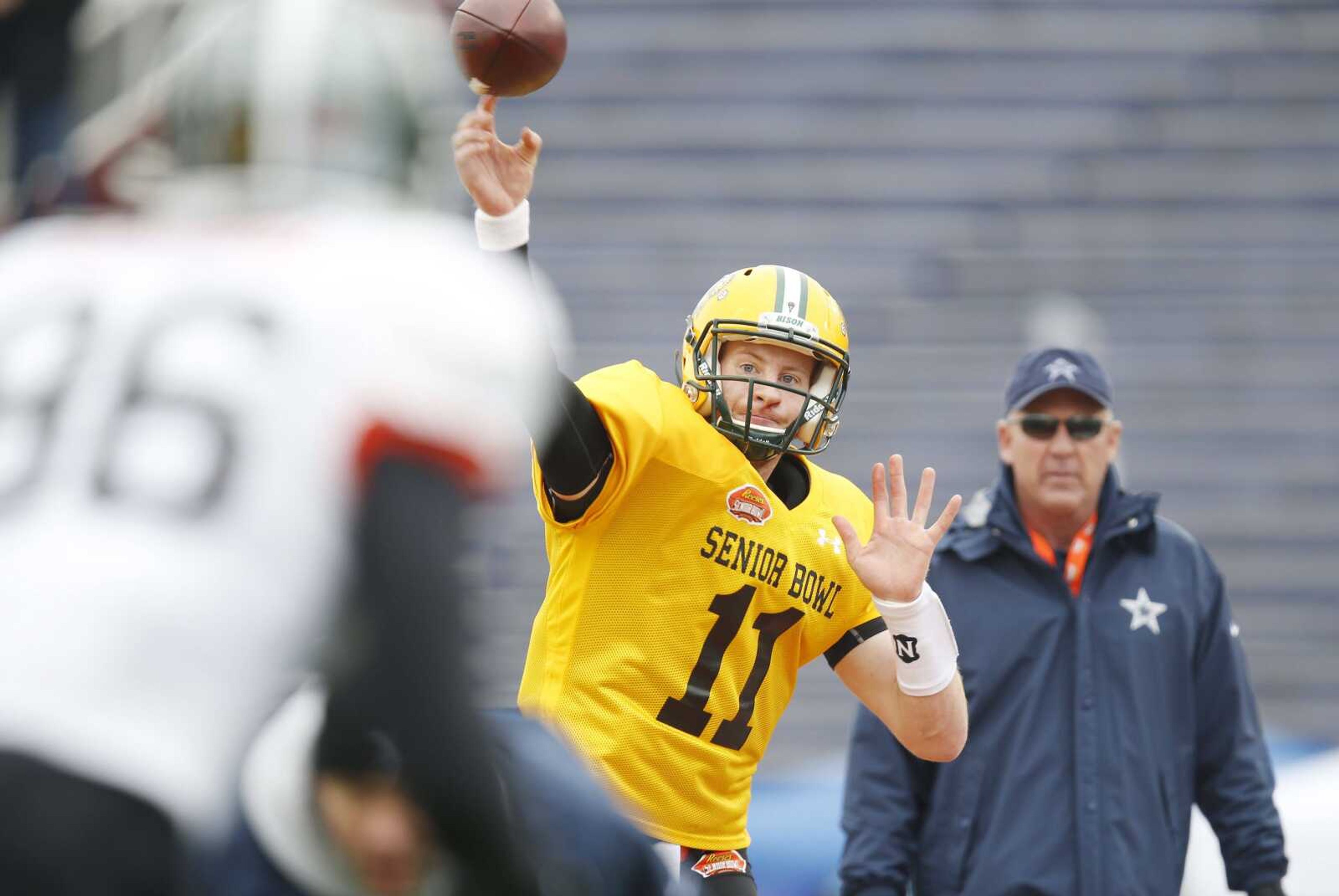 North Dakota State quarterback Carson Wentz of  (11) passes the ball during drills at an NCAA college football practice for the Senior Bowl, Wednesday, Jan. 27, 2016, at Ladd--Peebles Stadium, in Mobile, Ala. (AP Photo/Brynn Anderson)