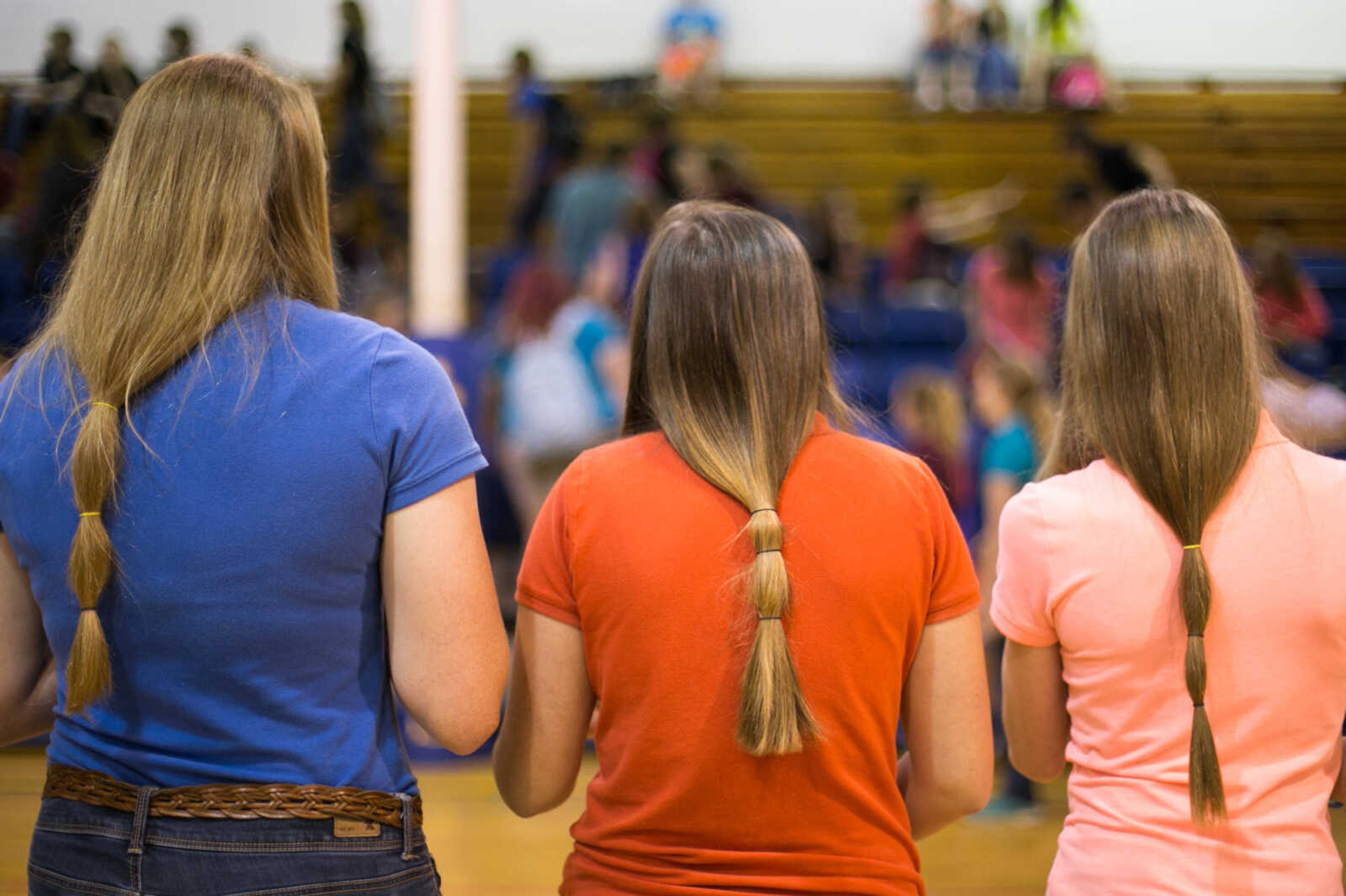 GLENN LANDBERG ~ glandberg@semissourian.com

Scott City students who plan to donate their hair, stand before their classmates during an assembly Monday, May 18, 2015 at Scott City High School.