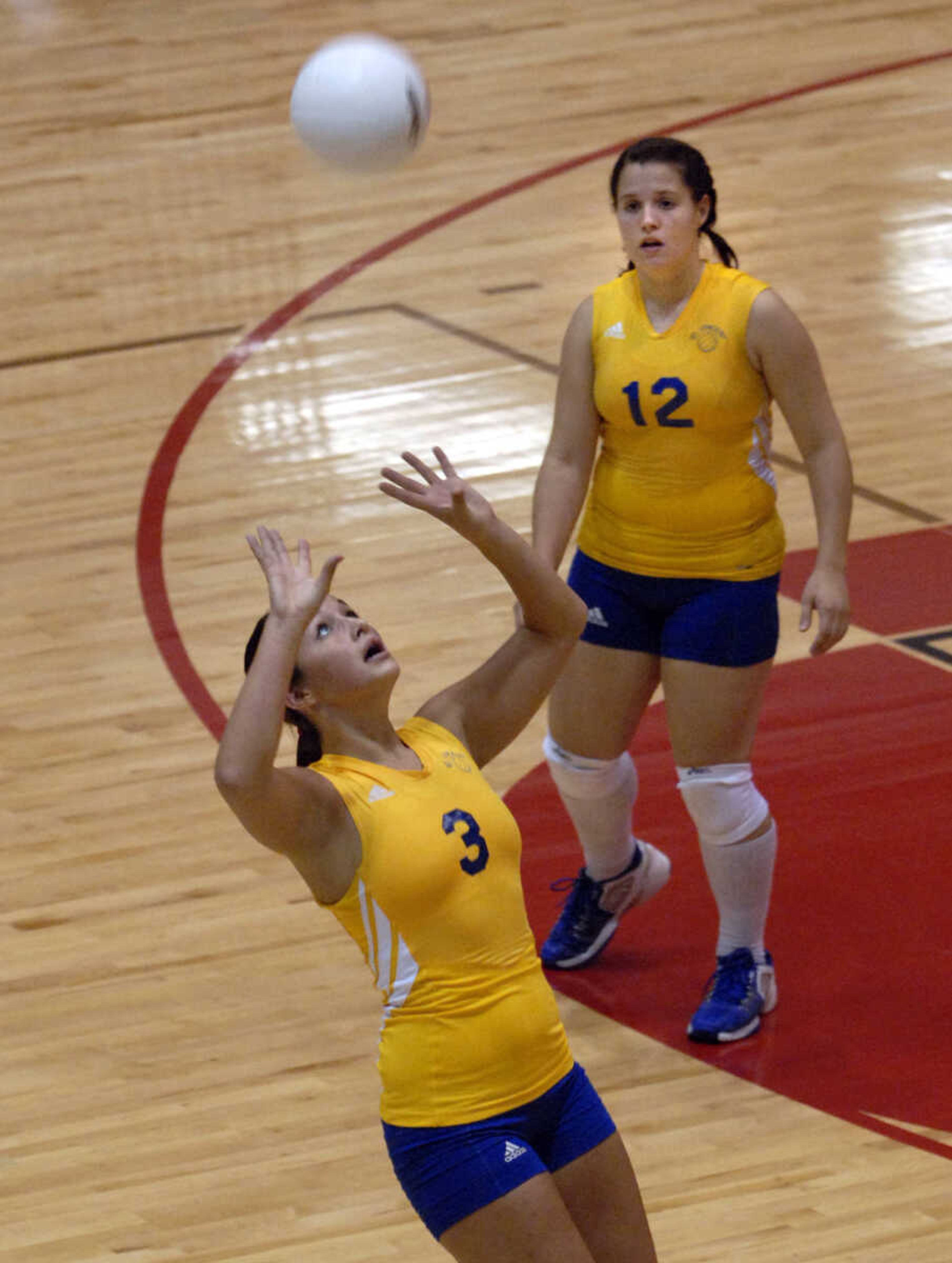 FRED LYNCH ~ flynch@semissourian.com
St. Vincent's Alanna Steinbecker sets the ball as teammate Nikki Julian looks on during the first game Tuesday at Jackson.