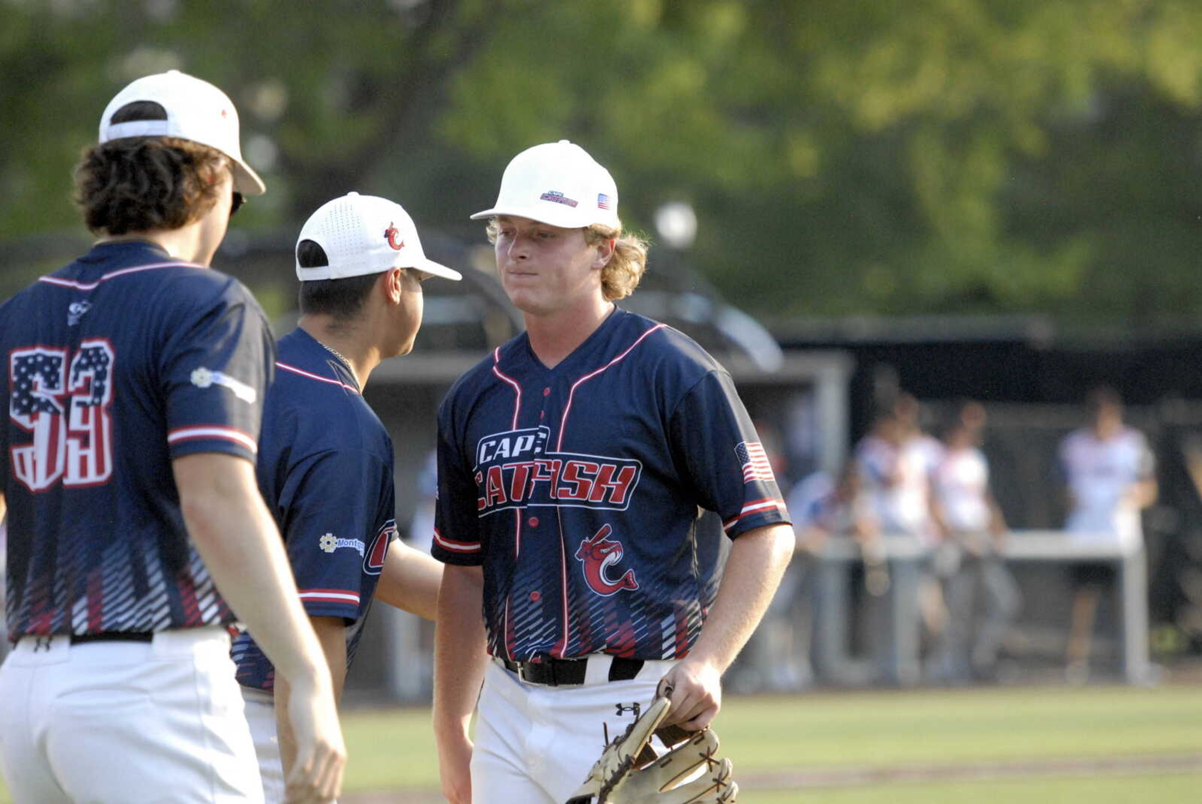 First-year Cape Catfish pitcher John-Paul Sauer is welcomed by his teammates following an inning of work against Illinois Valley on Saturday at Capaha Field.