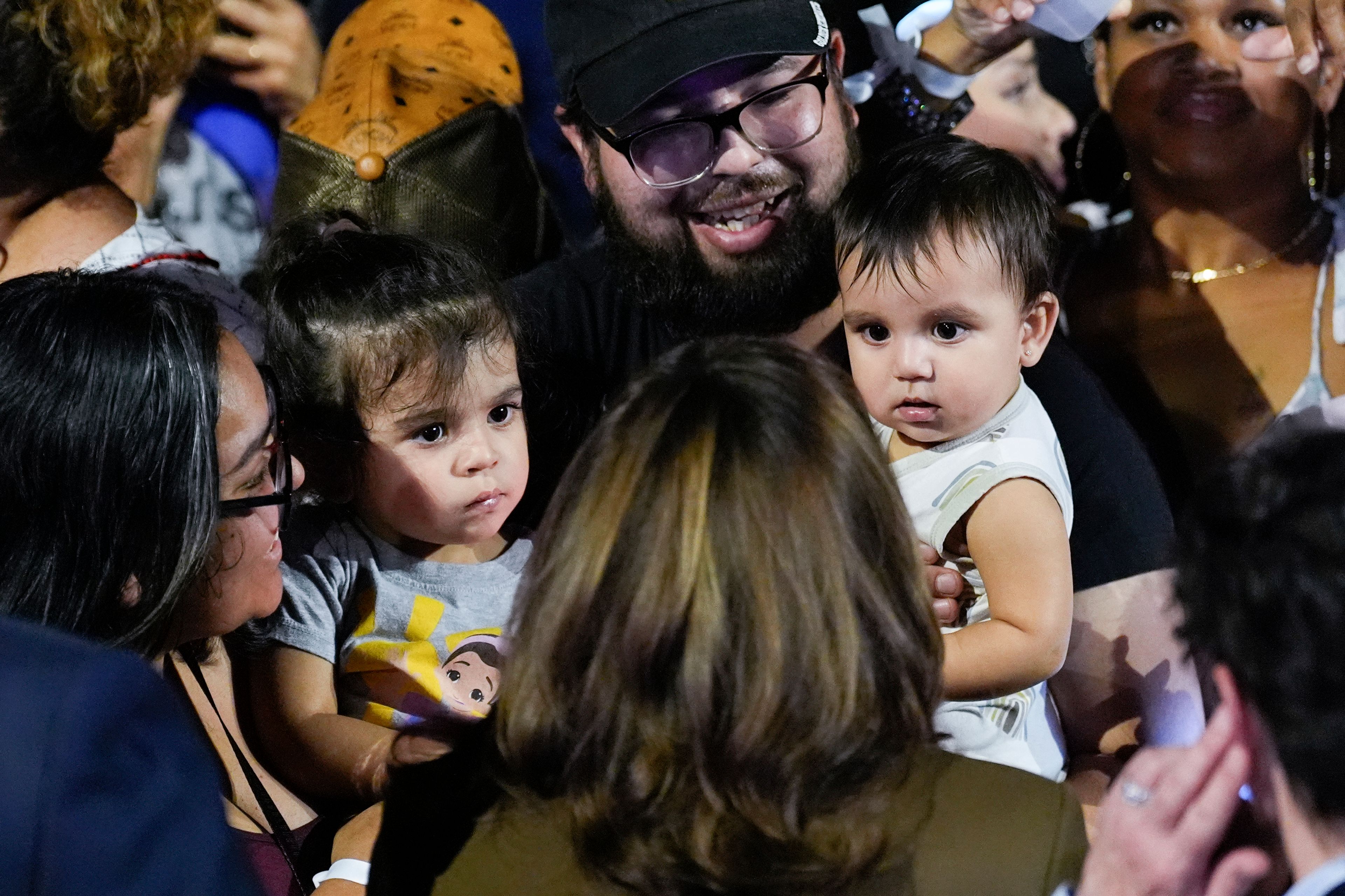 Democratic presidential nominee Vice President Kamala Harris, bottom center, greets people in the crowd after speaking at a rally on Sunday, Sept. 29, 2024, in Las Vegas. (AP Photo/Carolyn Kaster)