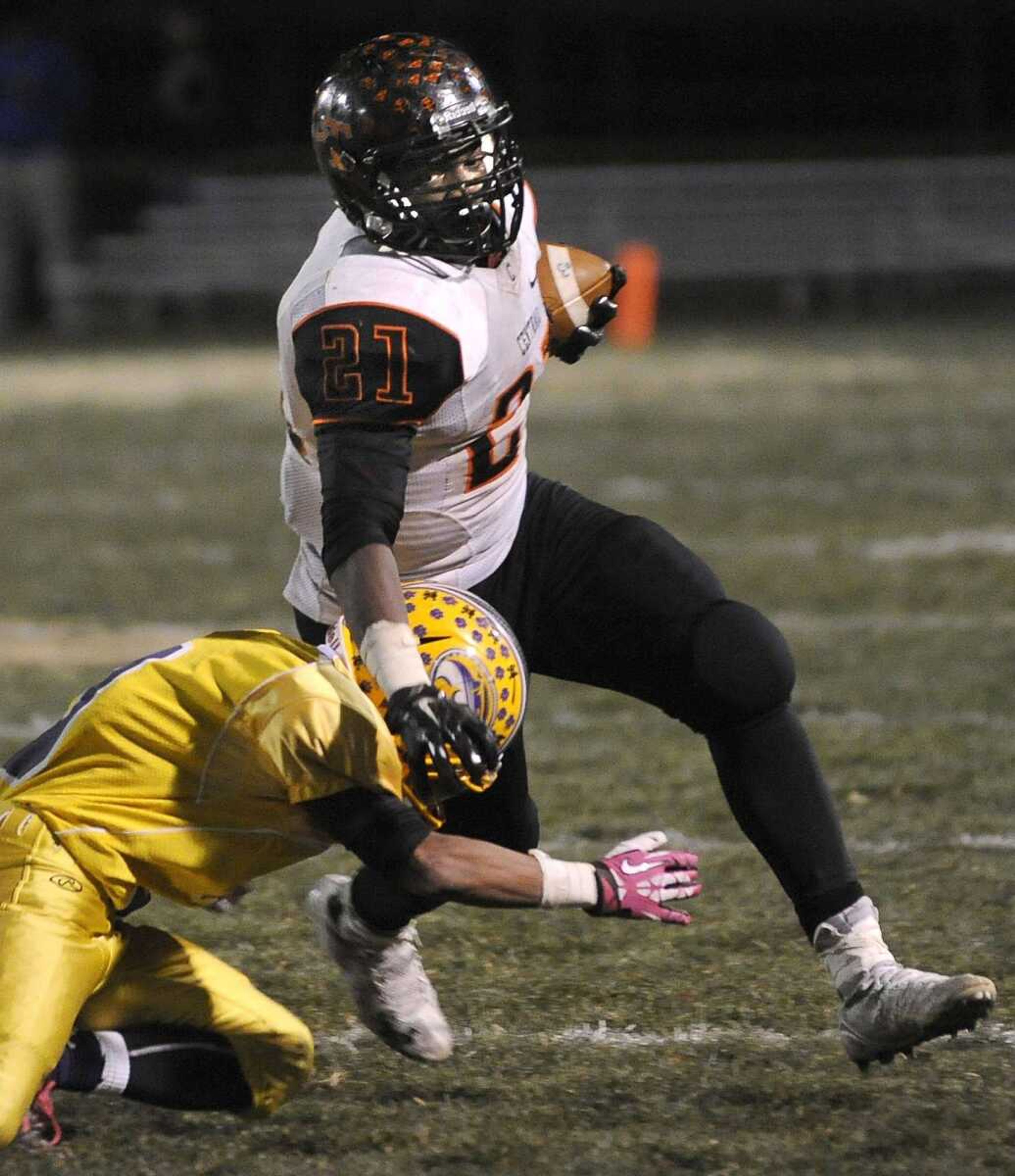 Central running back Braion Owens carries against Affton s Terrell Van during the fourth quarter of the Class 4 state quarterfinal Friday, Nov. 14, 2014 in Affton, Missouri. (Fred Lynch)