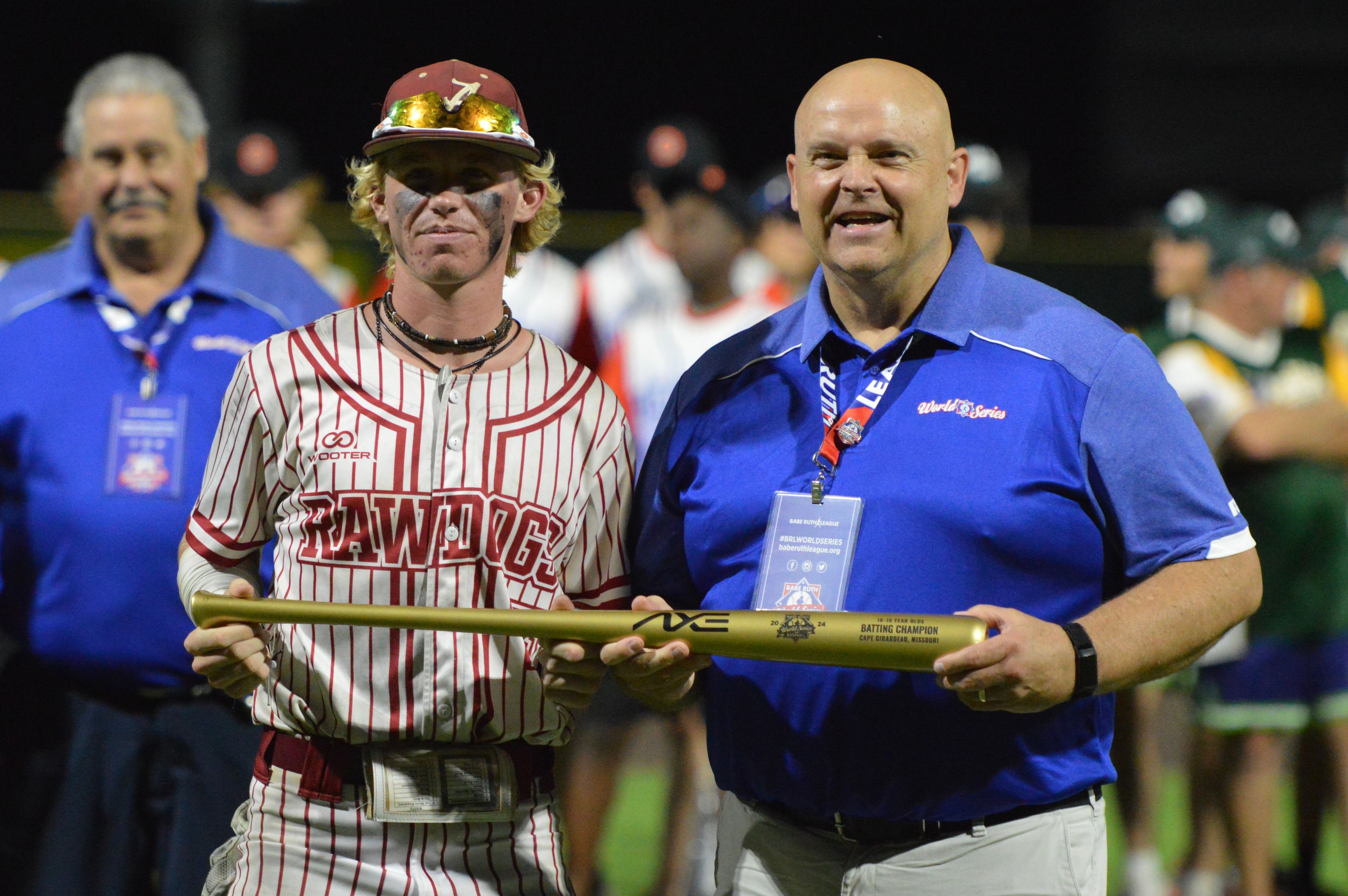 Alabama Rawdogs’ Joseph Stevens is handed the batting champion trophy at the Babe Ruth World Series on Thursday, Aug. 15, at Capaha Field in Cape Girardeau, Mo. 