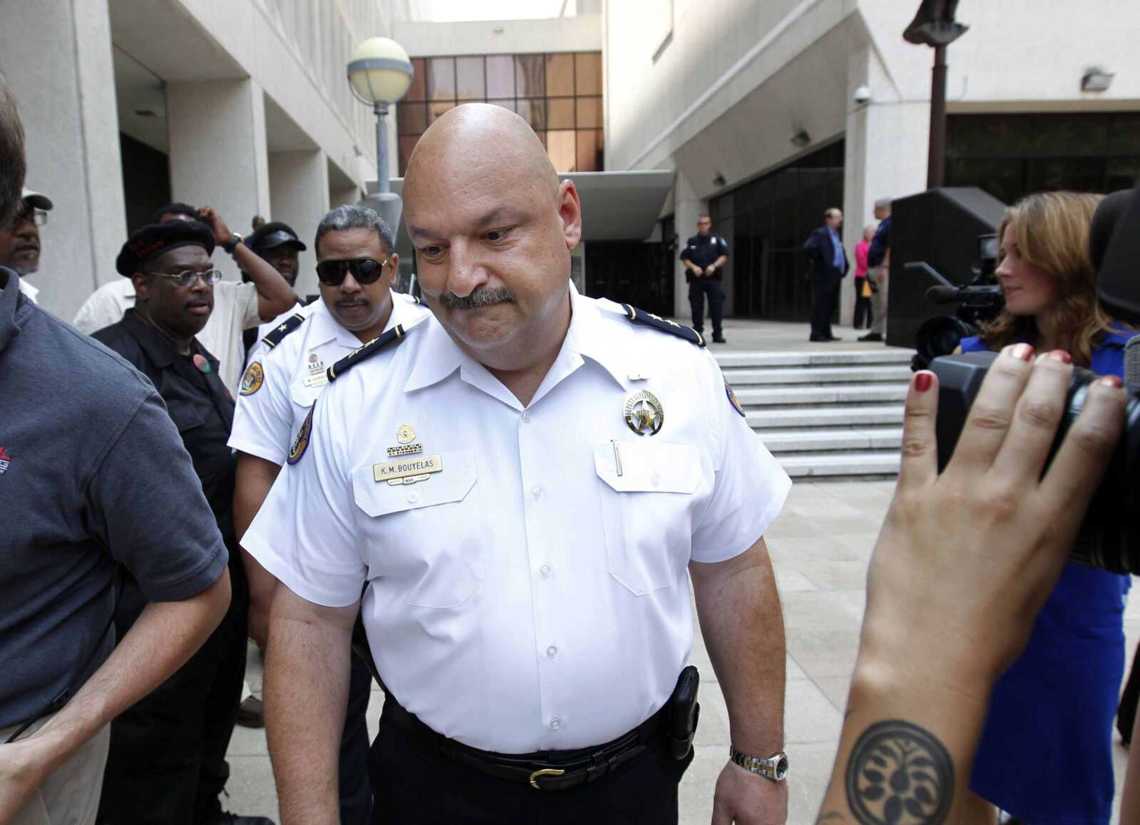 New Orleans police deputy superintendent Kirk Bouyelas leaves federal court in New Orleans after five current or former police officers were convicted Friday in the deadly 2005 shootings on a New Orleans bridge after Hurricane Katrina. Kaufman, who investigated the shootings, was charged only in the cover-up. (Gerald Herbert ~ Associated Press)