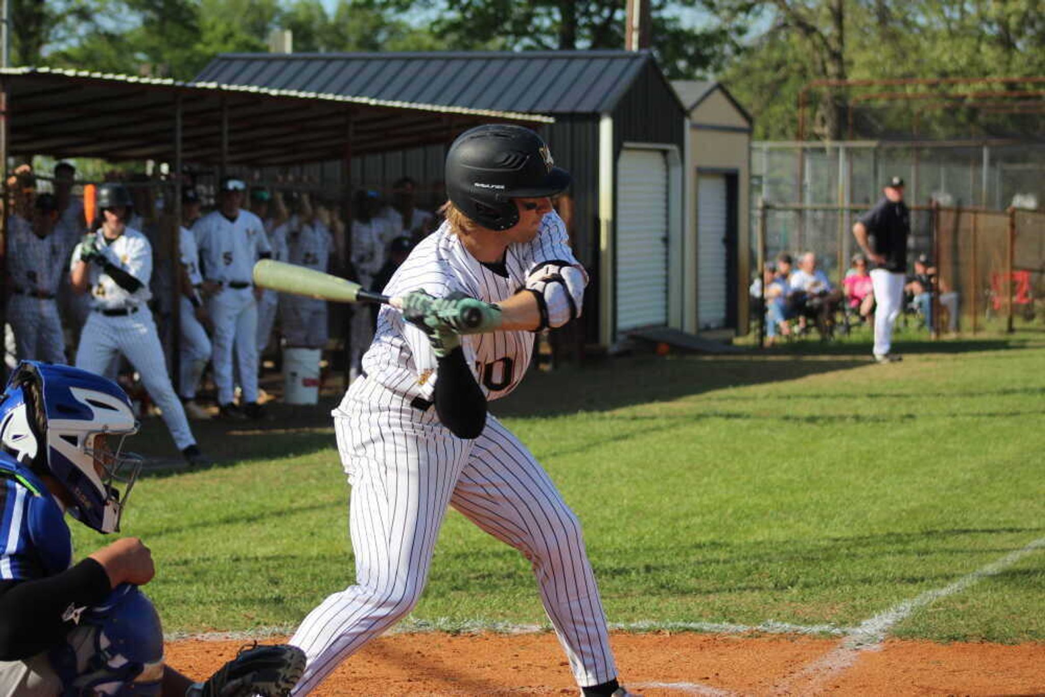 Kennett's Ashton Williams takes a cut at home during a regular season game.