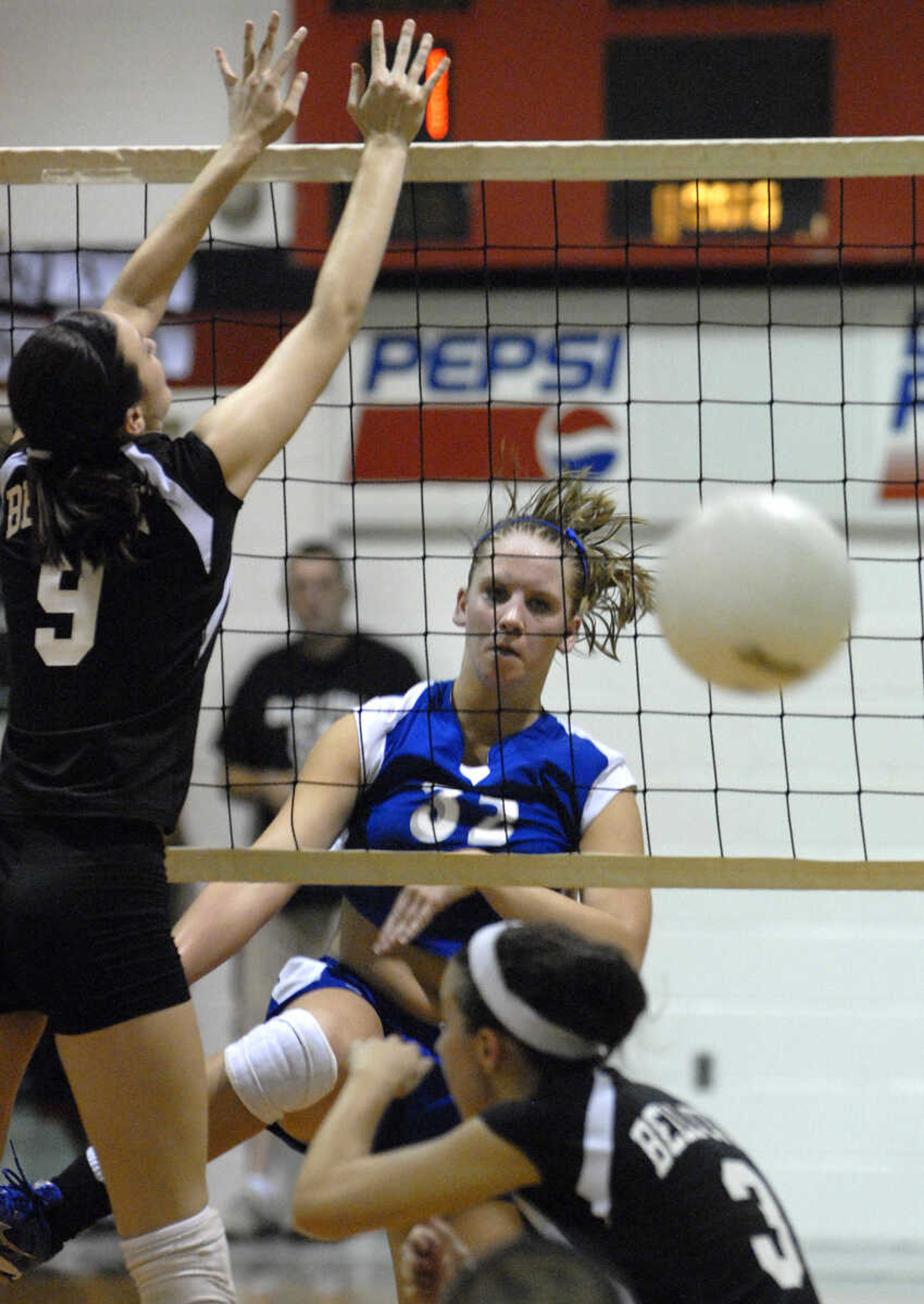 FRED LYNCH ~ flynch@semissourian.com
Leopold's Abby Landewee spikes the ball past Bell City's Alex Eakin, left, and Ashley Green during the fourth game Friday at Bell City.