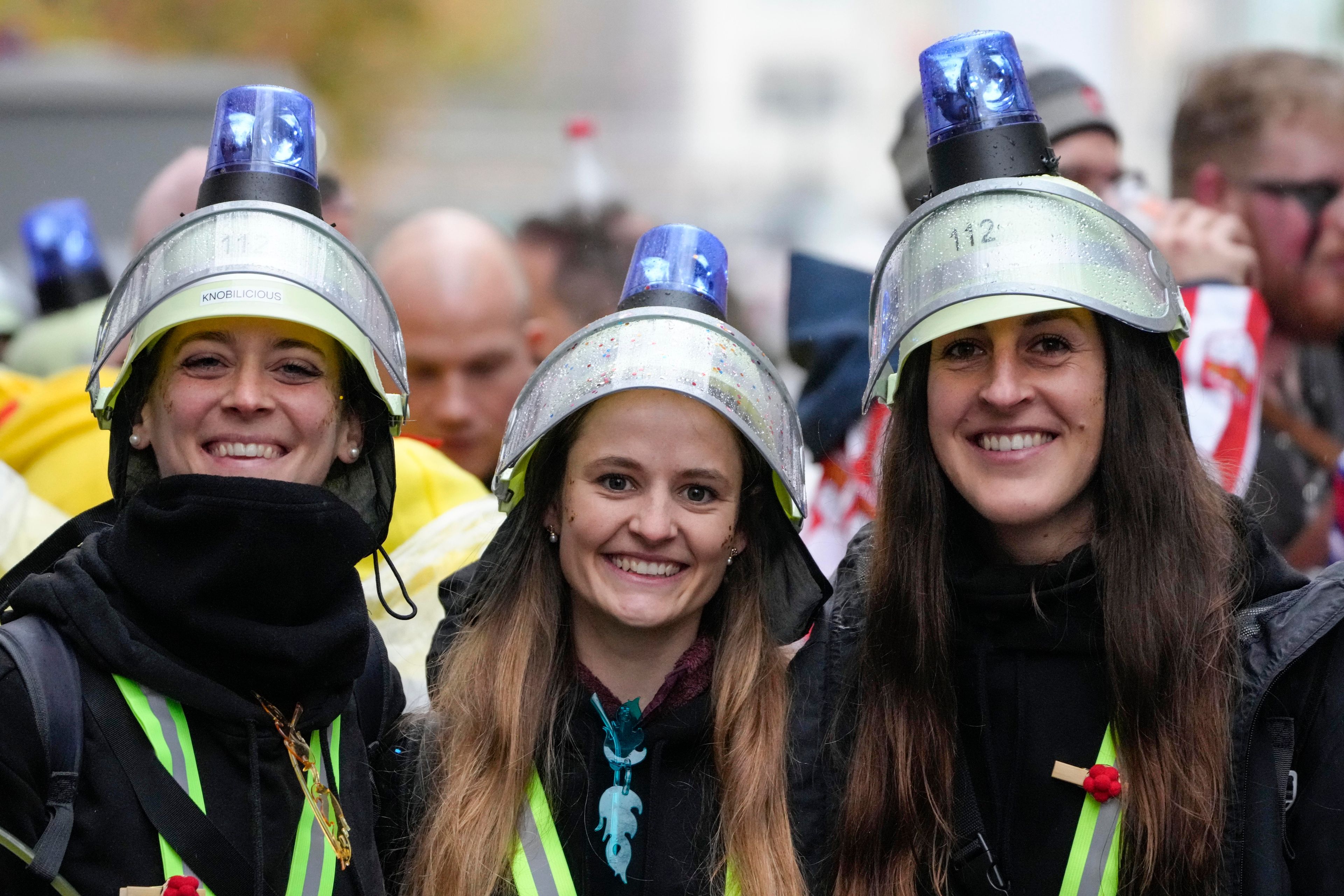 Revelers celebrate at the central Heumarkt while tens of thousands of carnival fools take to the streets of Cologne, Germany, on Monday, November 11, 2024, heralding the official start of the carnival season.(AP Photo/Martin Meissner)