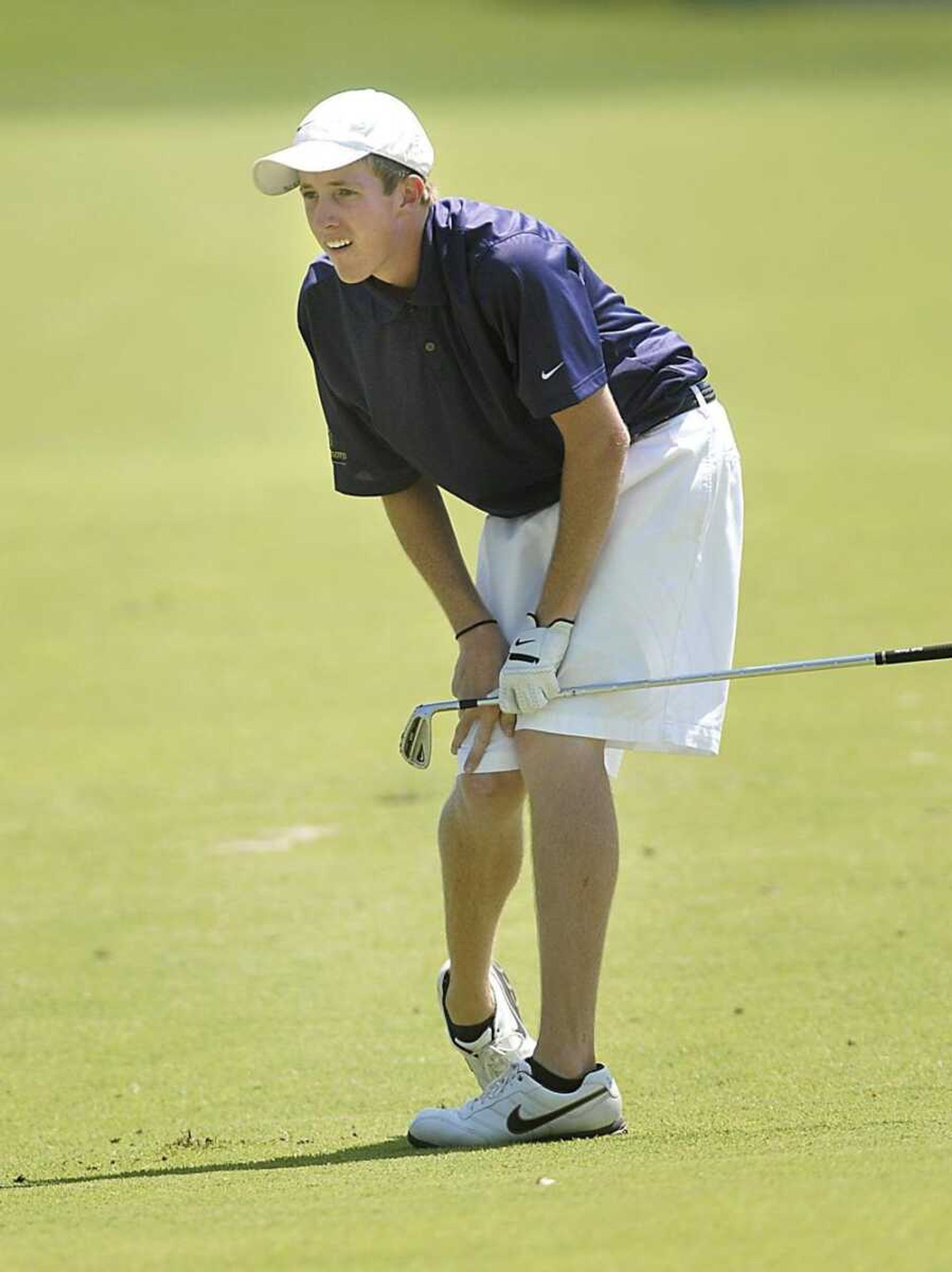 Texan Ty Spinella hunkered down for a better view of his iron shot Thursday at Dalhousie Golf Club.