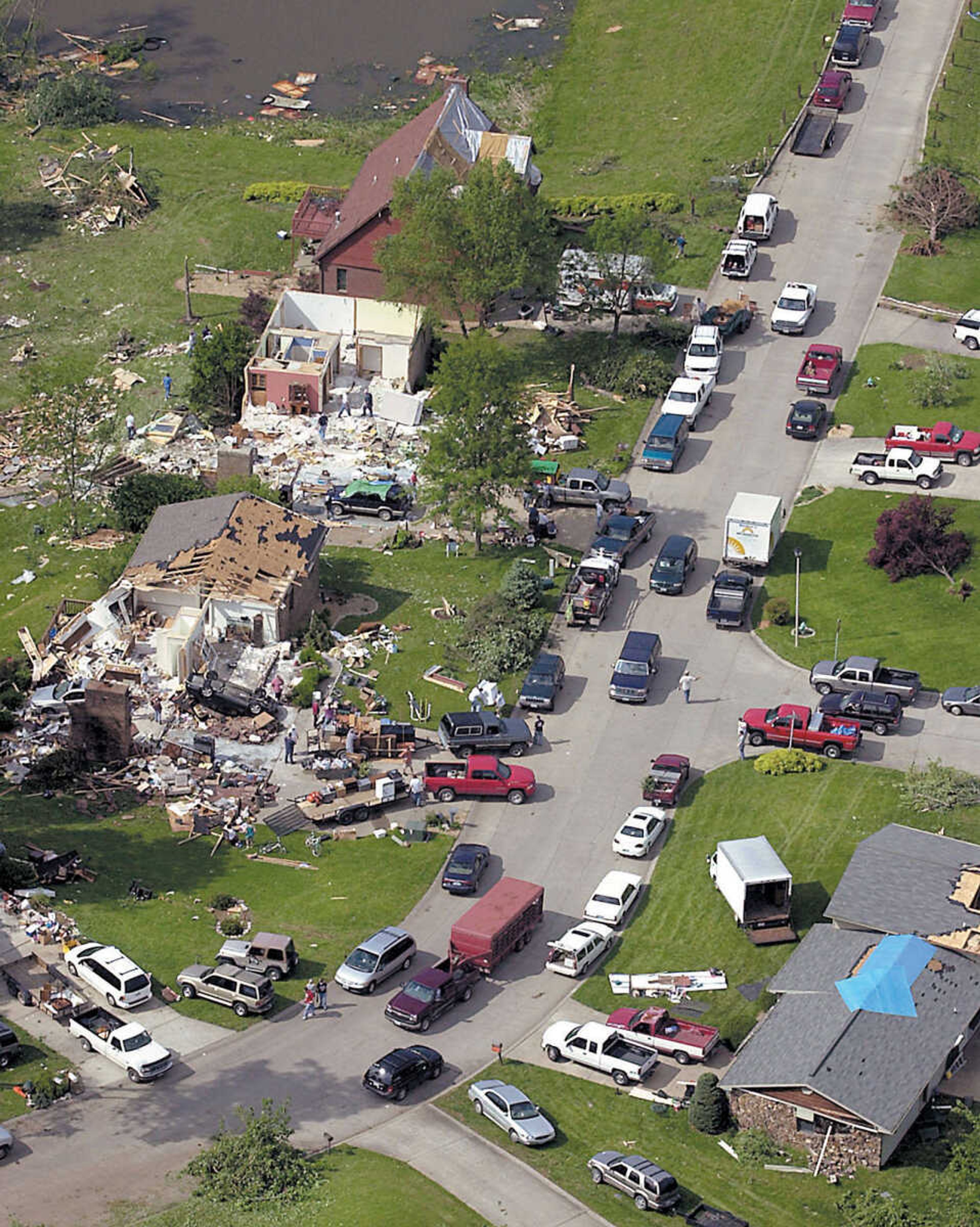 FRED LYNCH ~ flynch@semissourian.com
Friends and neighbors with pickup trucks and trailers helped residents Wednesday afternoon, May 7, 2003, to salvage what they could from their homes that were hit hard by Tuesday night's tornado, which struck several subdivisions in the Bent Creek area of Jackson.