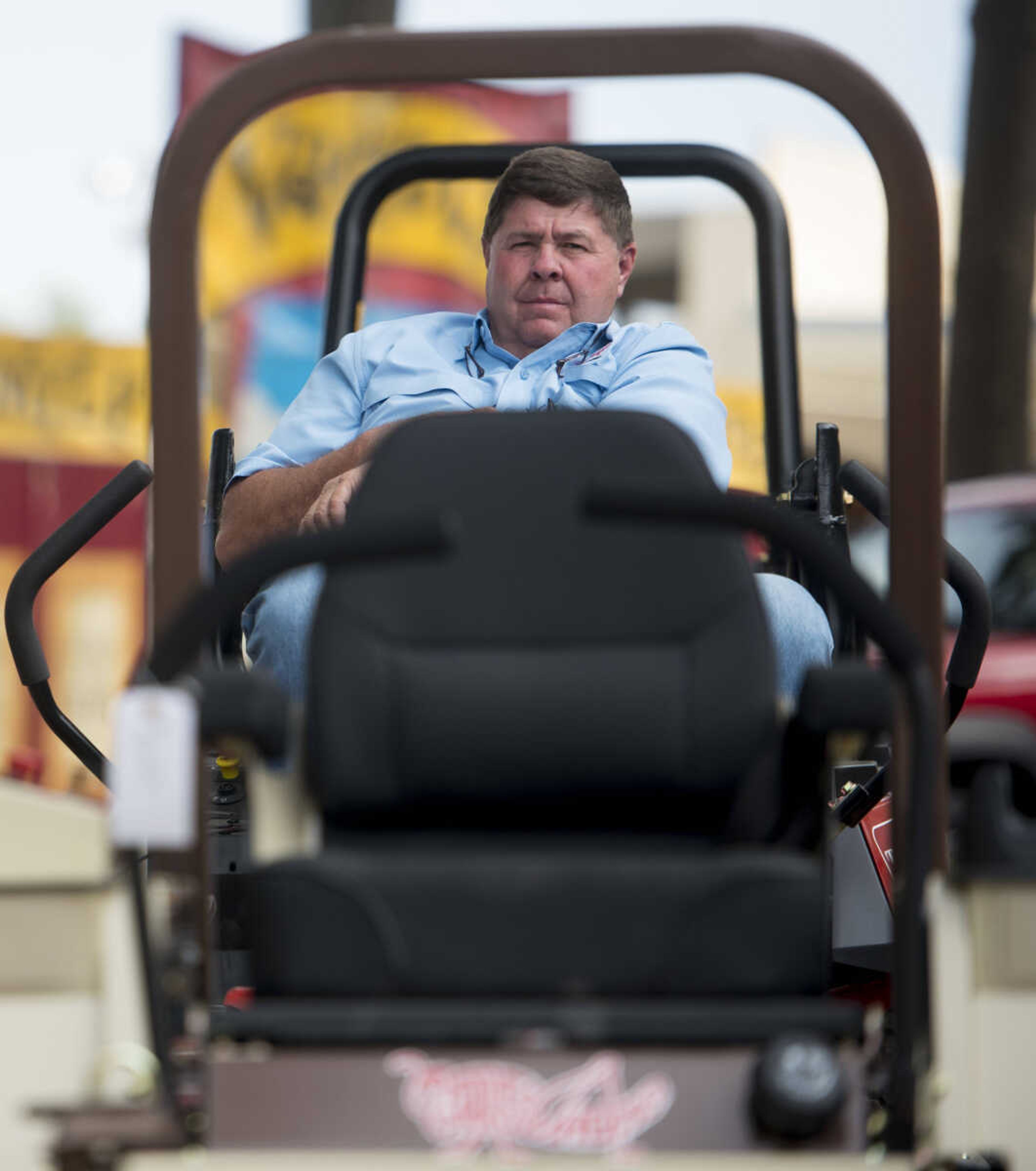 James Farley sits with his Grasshopper mowers at the SEMO District Fair on September 11, 2017, in Cape Girardeau.