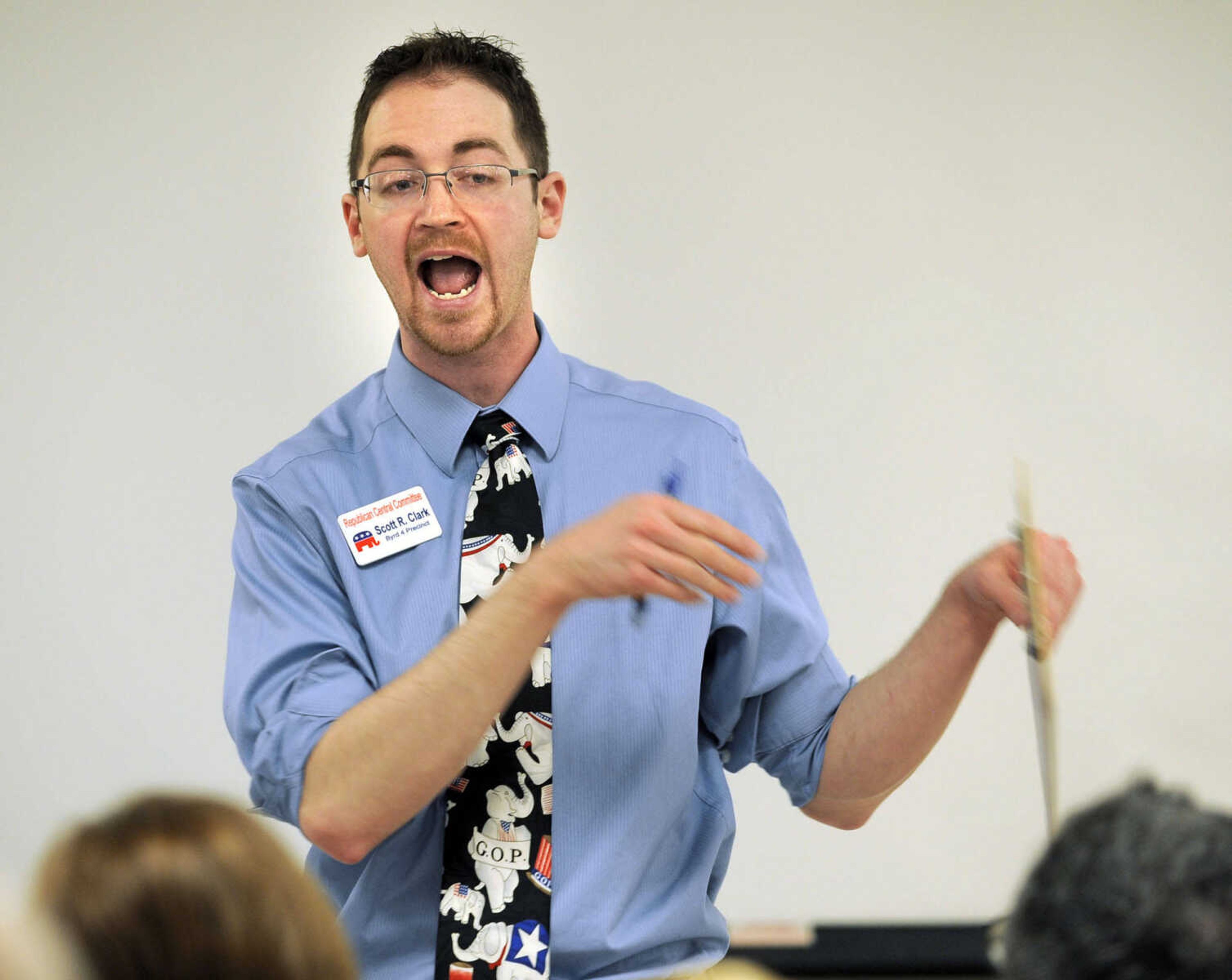 FRED LYNCH ~ flynch@semissourian.com
Scott R. Clark discusses a point with the supporters for Rick Santorum at the Cape Girardeau County GOP caucus Saturday, March 17, 2012 in Jackson.