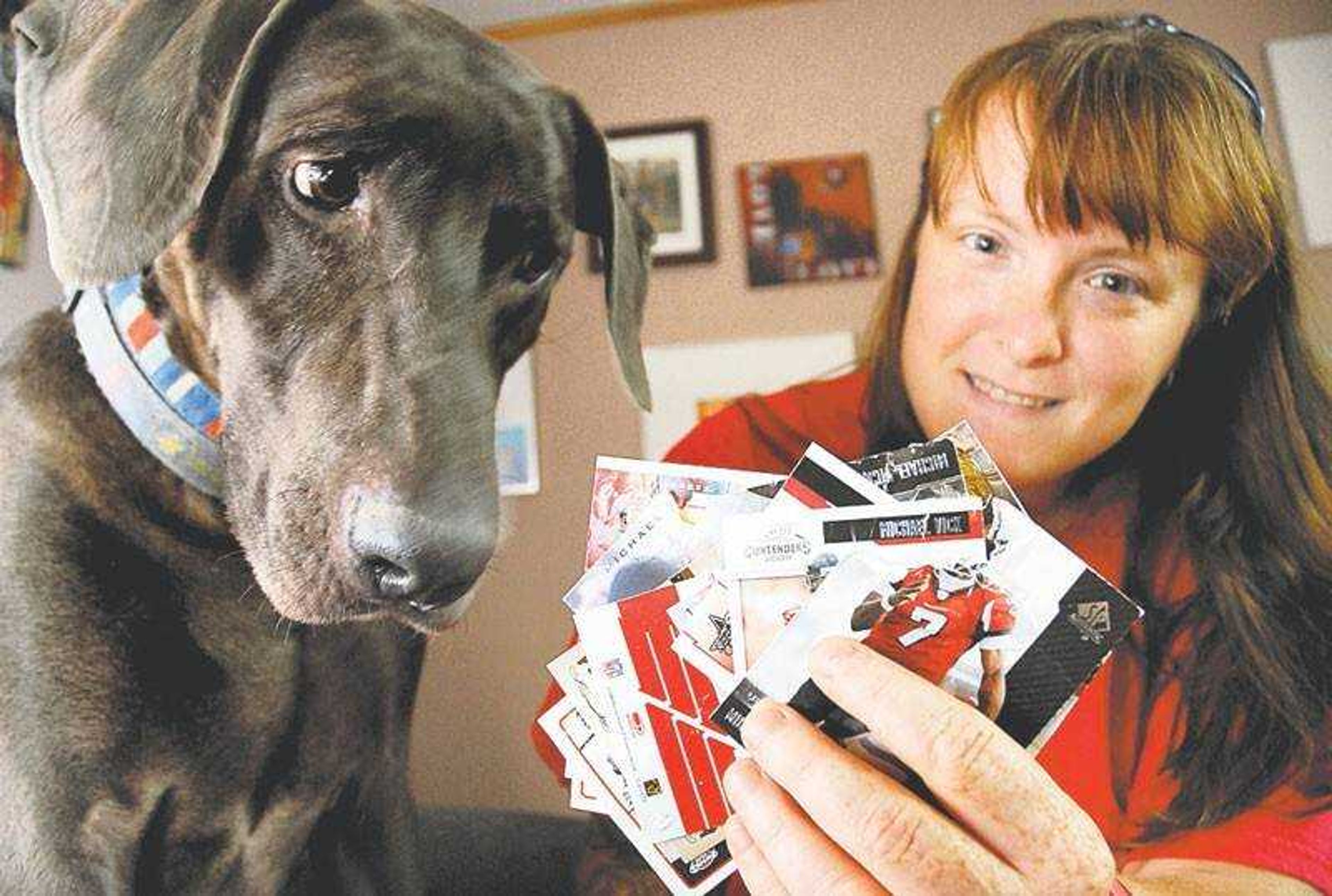 Rochelle Steffen and her 6-year-old Weimaraner, Monte, displayed the lot of 22 Michael Vick trading cards that were chewed by Monte as well as Steffen's other dog Roxie, a 5-month-old Great Dane. Steffen auctioned the cards on eBay, bringing in $7,400 for charity.