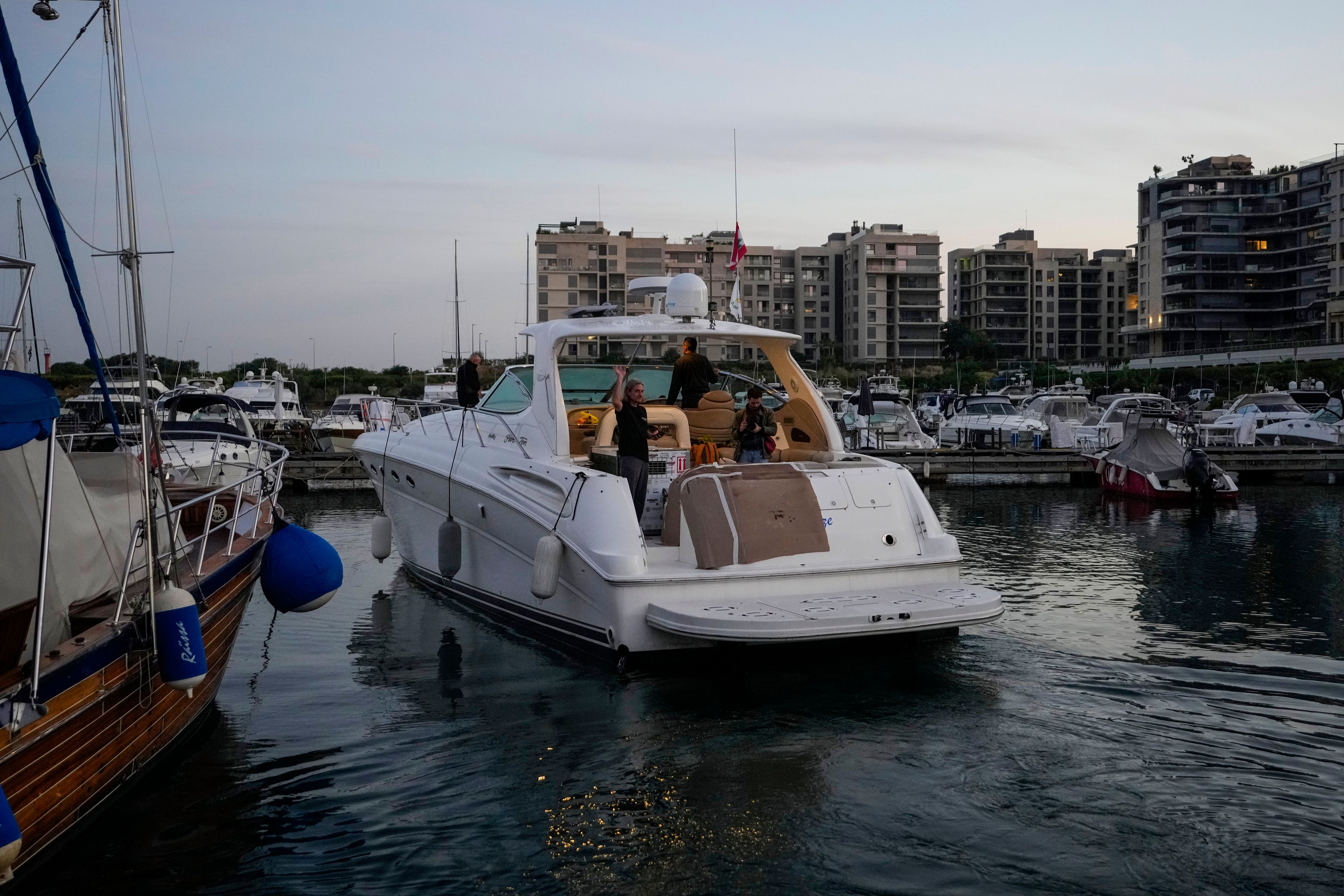 A yacht carrying Sara the lion cub leaves at the Dbayeh sea port, north of Beirut, Lebanon, Thursday, Nov. 14, 2024. (AP Photo/Hassan Ammar)