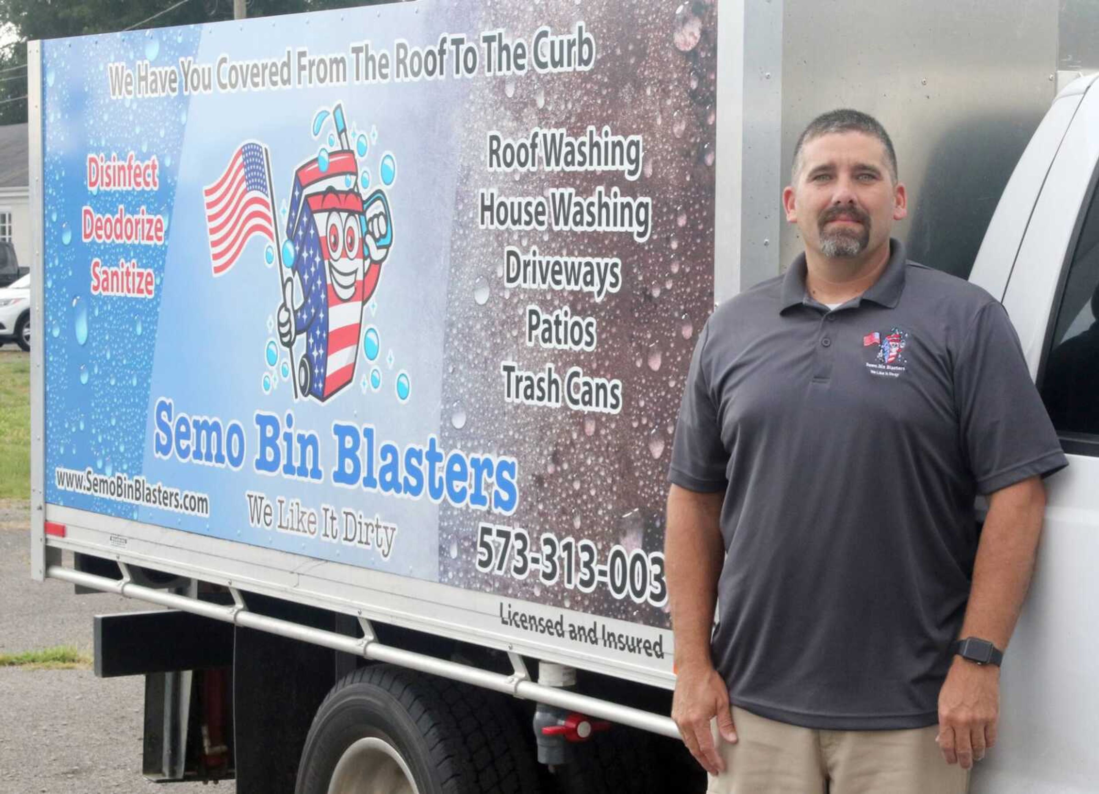 Robby Lemonds, owner of SEMO Bin Blasters, poses next to his truck.