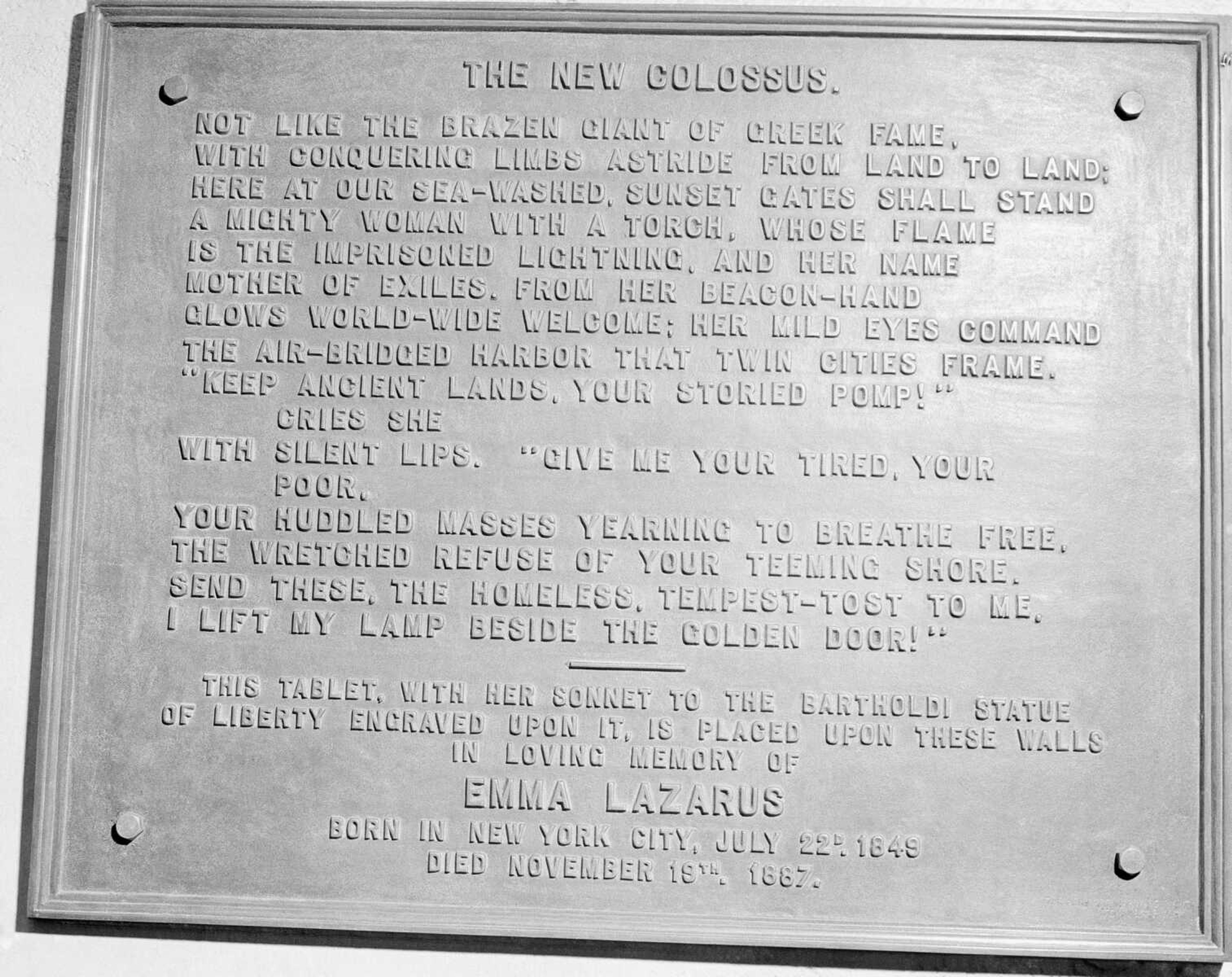 A bronze plaque of the poem by Emma Lazurus is seen on the Statue of Liberty in New York in 1950. Lazarus wrote "The New Colossus" in 1883, one year after Congress passed the Chinese Exclusion Act, which banned laborers from China. Long before a Trump administration official suggested the poem welcomed only people from Europe, the words captured America's promise to newcomers at a time when the nation was also seeking to exclude many immigrants from landing on its shores.