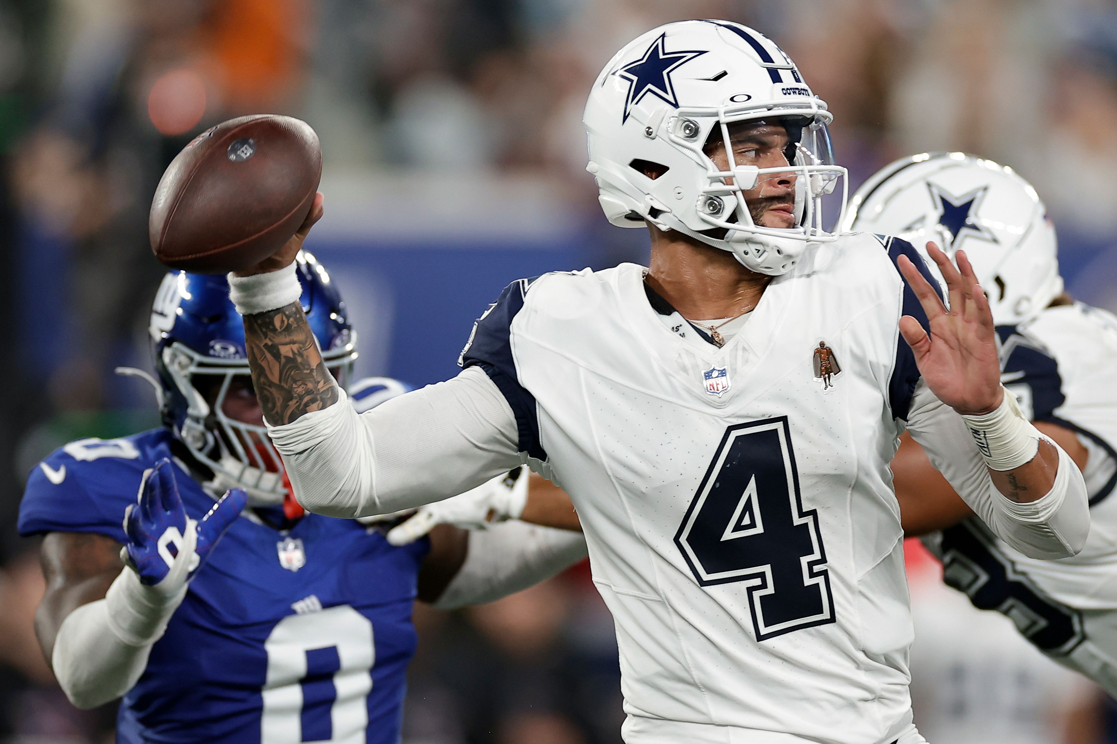 Dallas Cowboys quarterback Dak Prescott (4) passes against the New York Giants during the second quarter of an NFL football game, Thursday, Sept. 26, 2024, in East Rutherford, N.J. (AP Photo/Adam Hunger)