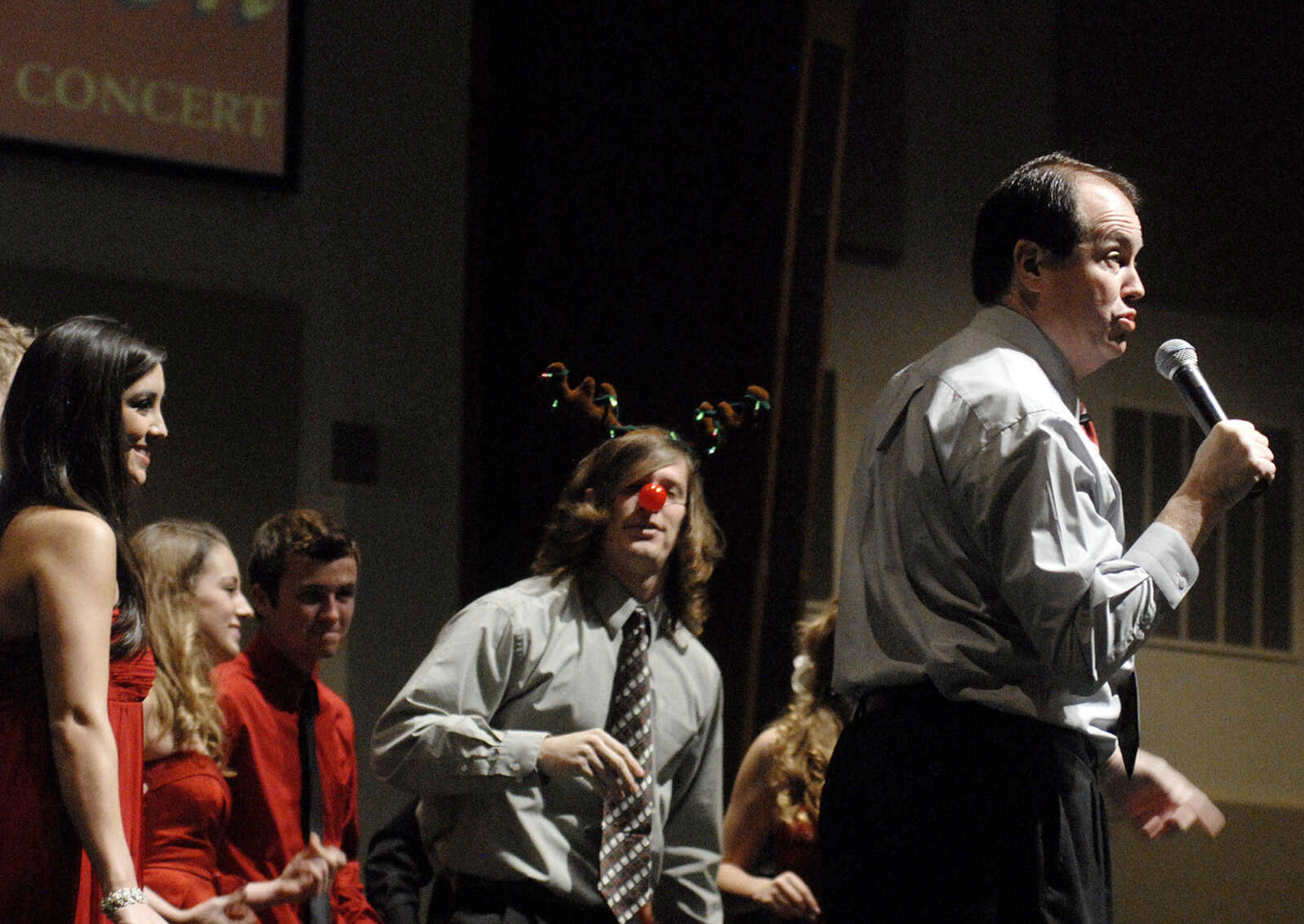 LAURA SIMON~lsimon@semissourian.com
Master of Ceremonies Mike Dumey performs during the Sounds of the Season holiday concert at Cape Bible Chapel Sunday, December 5, 2010 in Cape Girardeau. Five-hundred forty people attendded the 15th annual benefit concert which supports cancer services and programs of SoutheastHEALTH.