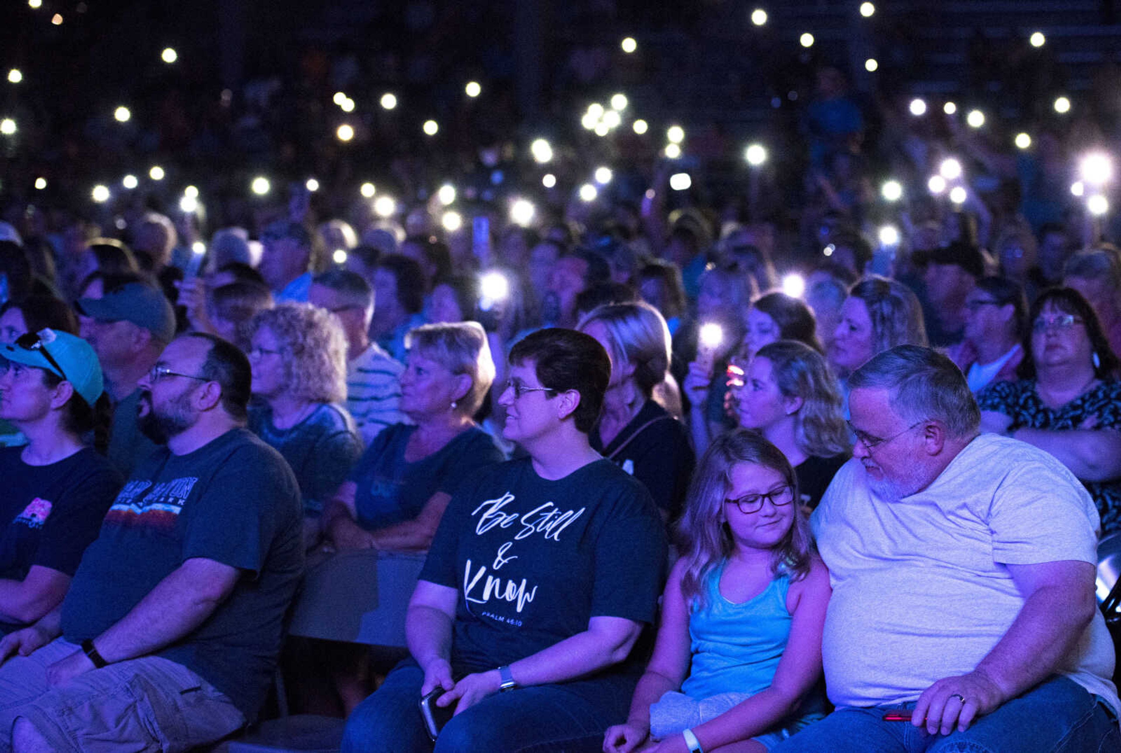 Audience members raise the flashlights on their phones as Jason Crabb performs during the SEMO District Fair Tuesday, Sept. 10, 2019, at the Arena Park grandstand in Cape Girardeau.