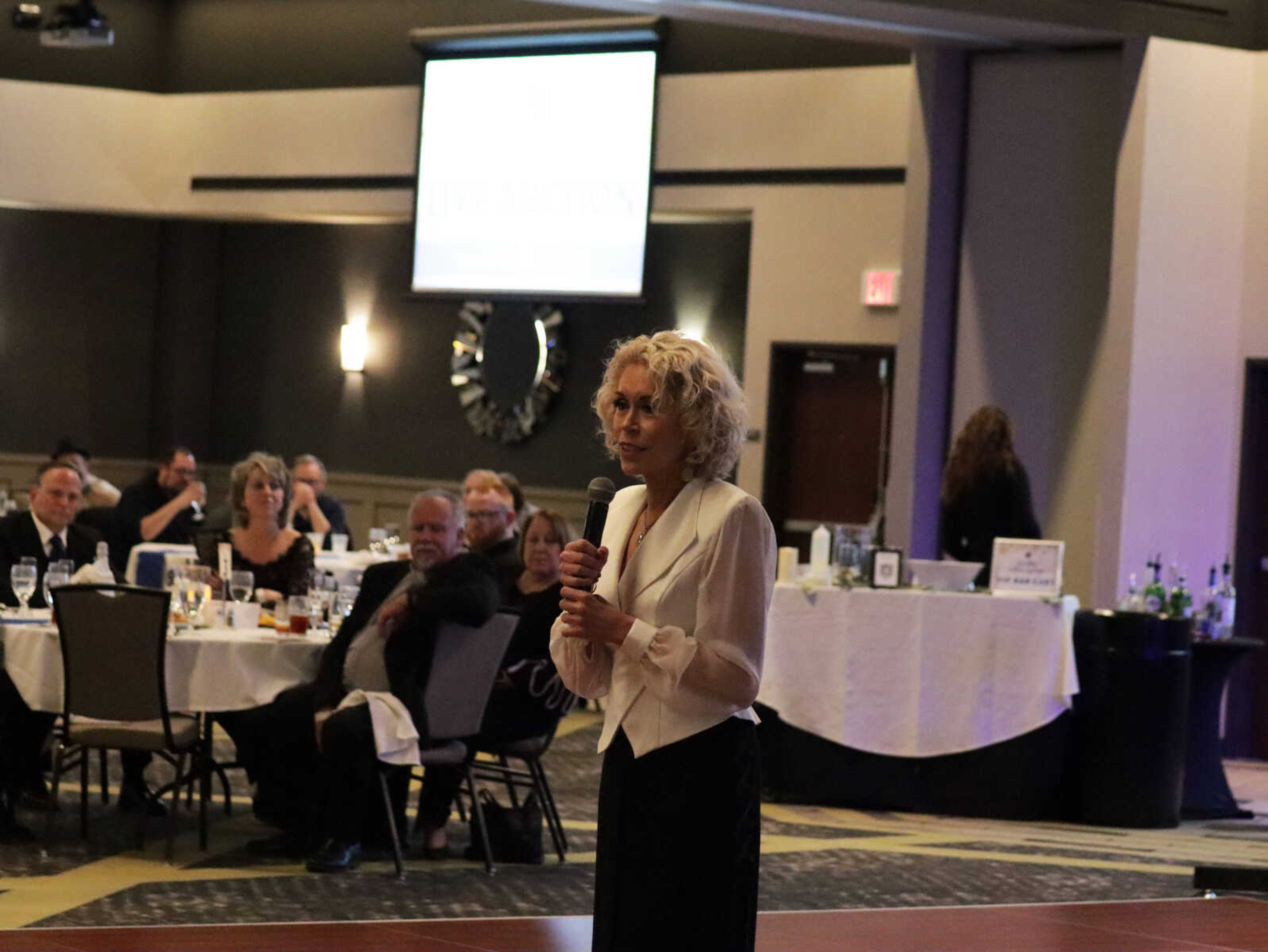 Maryann Reese  talks to the crowd about her time  with Saint Francis and her appreciation of Notre Dame.