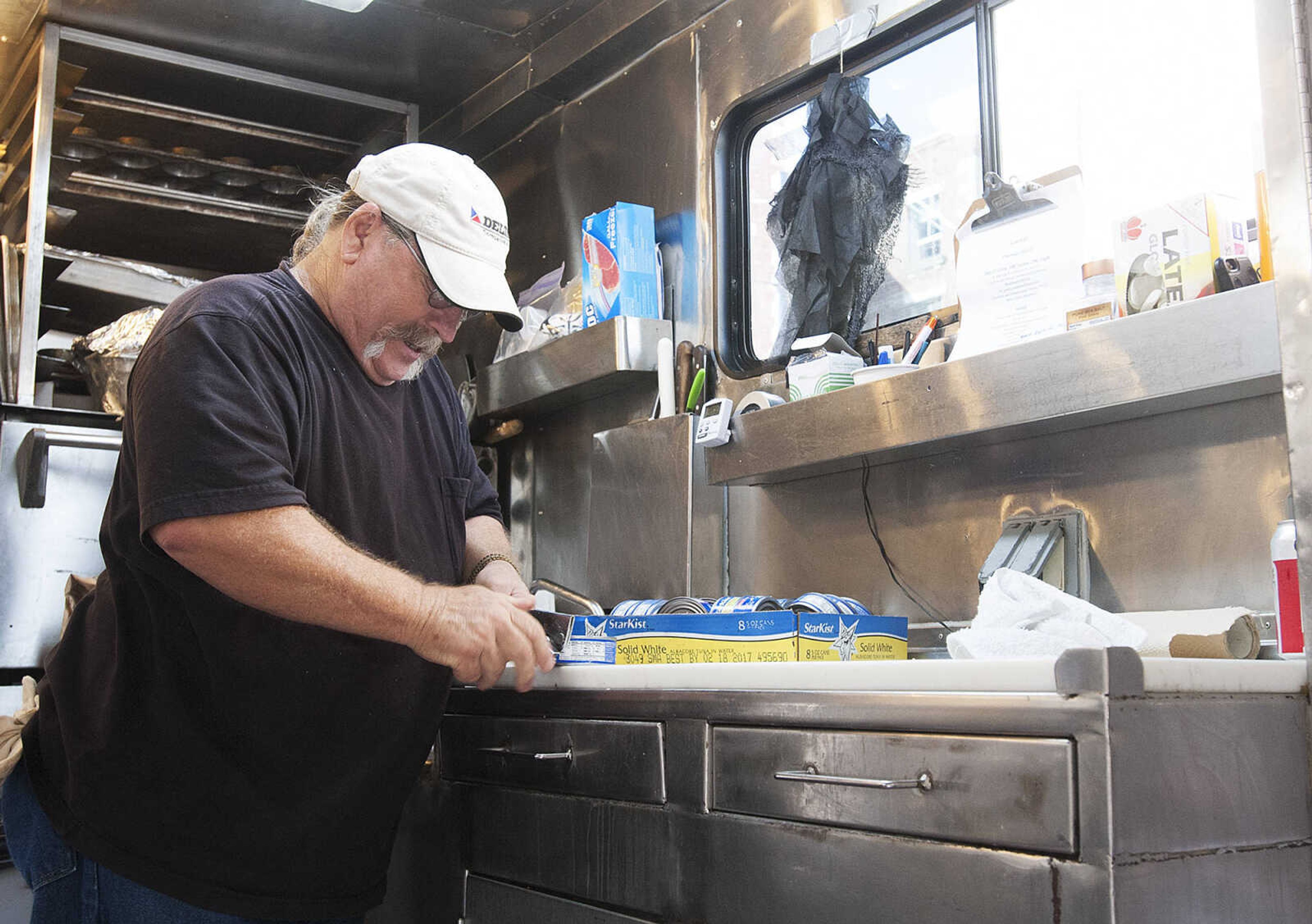 ADAM VOGLER ~ avogler@semissourian.com
Les Lindy, of Cape Girardeau, helps prepare dinner for the cast and crew of the 20th Century Fox feature film "Gone Girl," Thursday, Oct. 3. For Stars Catering, which is based in Carlsbad N. M., is serving meals to up to 120 people each day.