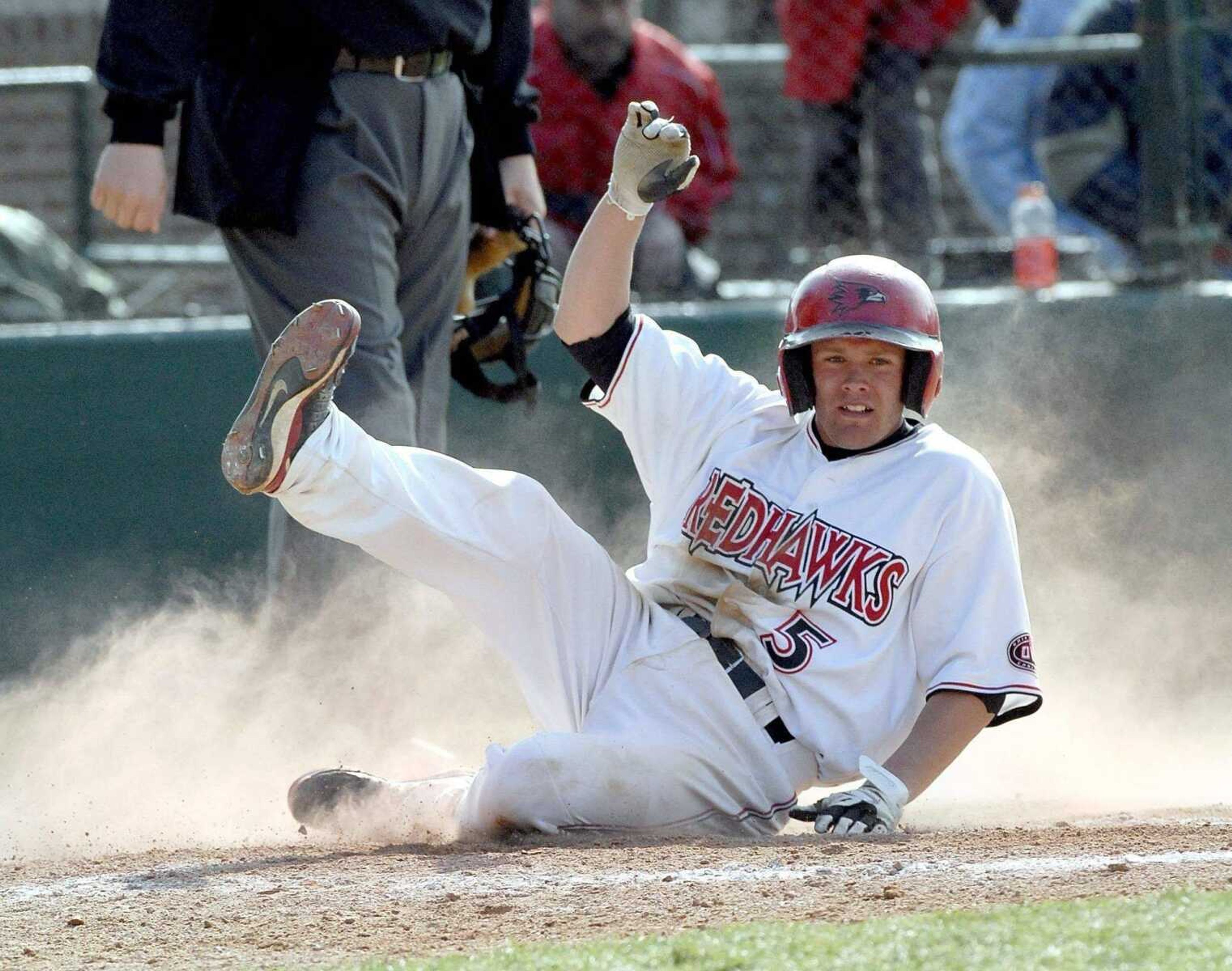 ELIZABETH DODD ~ edodd@semissourian.com<br>Tony Spencer slides home safely during Friday's victory against Northern Illinois.