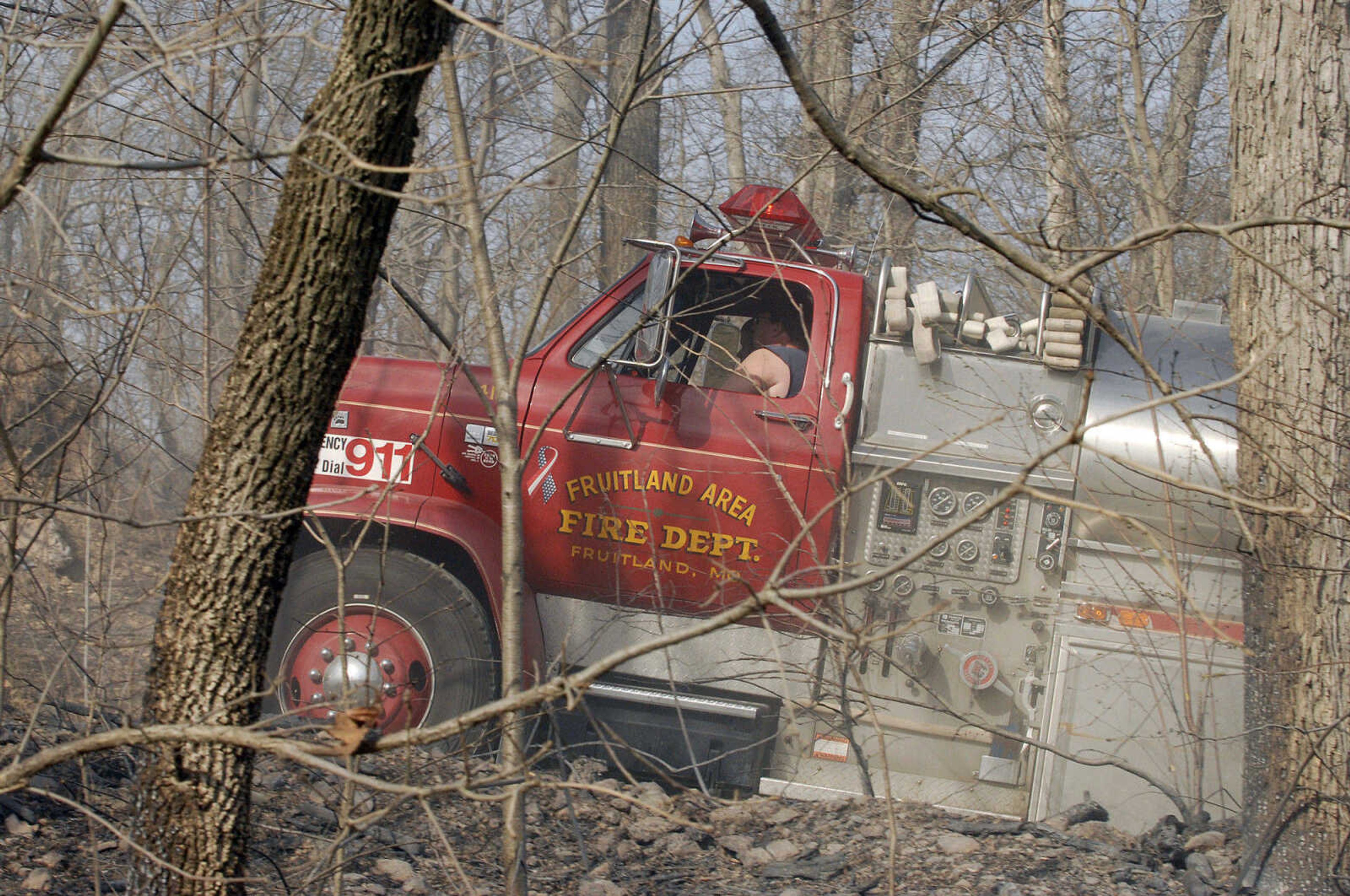 LAURA SIMON~lsimon@semissourian.com
The Fruitland area fire department arrives with another tank of water to help battle a natural cover fire off of Cissus Lane near Neelys Landing Sunday, April 3, 2011. Firefighters from Cape Girardeau, Perry, Scott, and Bollinger Counties contained the blaze that ravaged 50 acres of land.