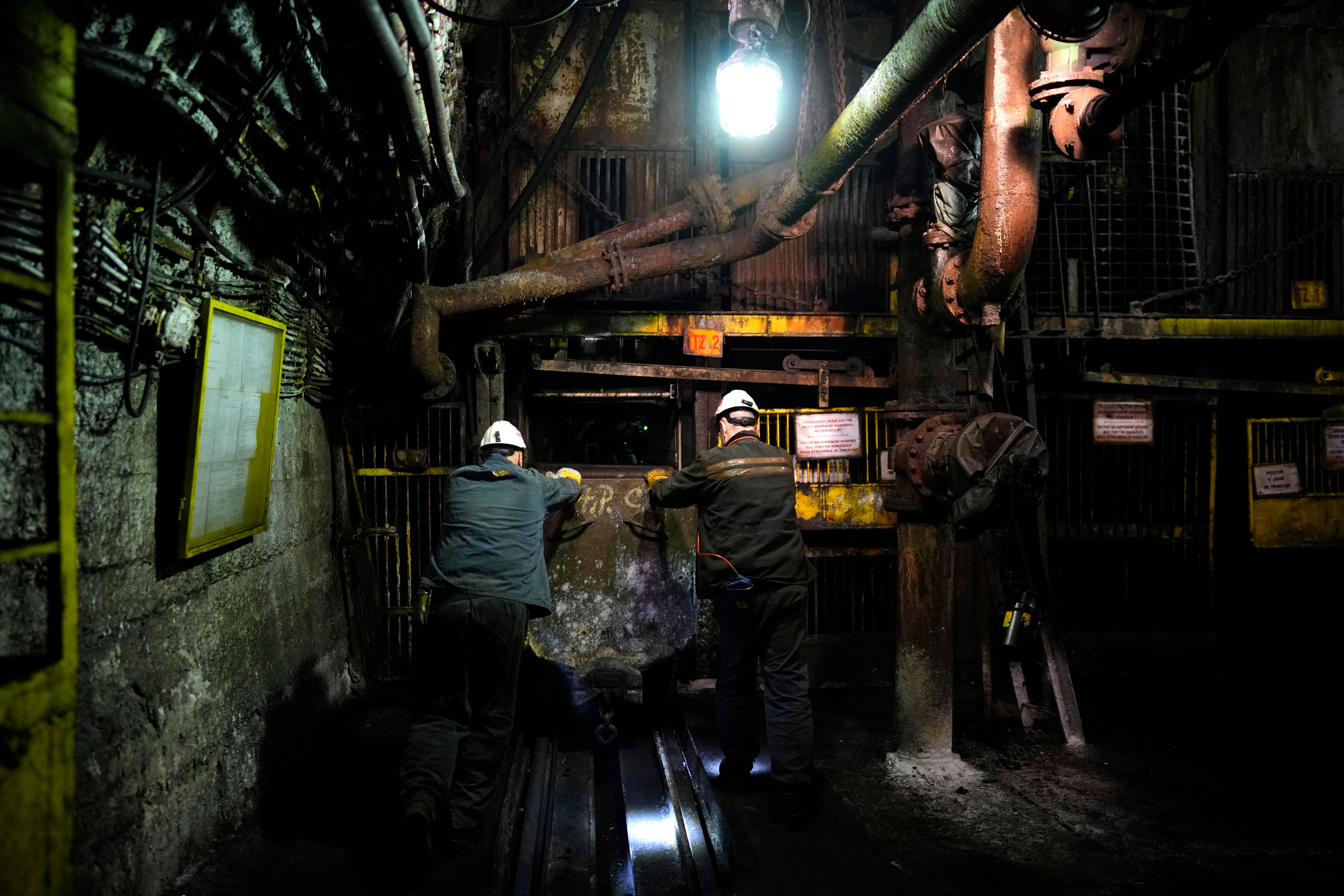 Miners push a trolley in a shaft of the CSM coal mine in Stonava, Czech Republic, Monday, Oct. 14, 2024. (AP Photo/Petr David Josek)