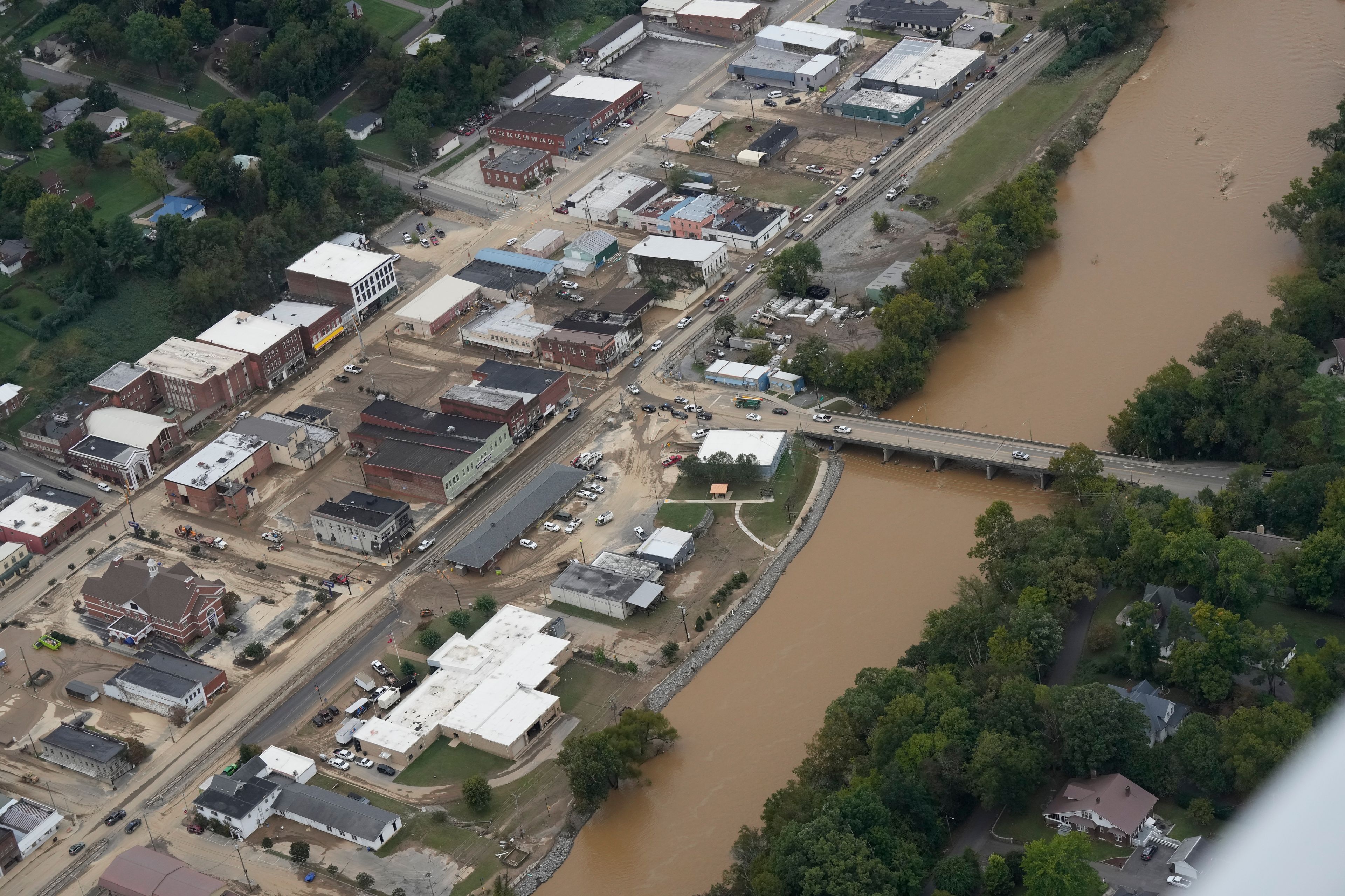 An aerial view of flood damage along the Pigeon River left by Hurricane Helene, Saturday, Sept. 28, 2024, in Newport, Tenn. (AP Photo/George Walker IV)