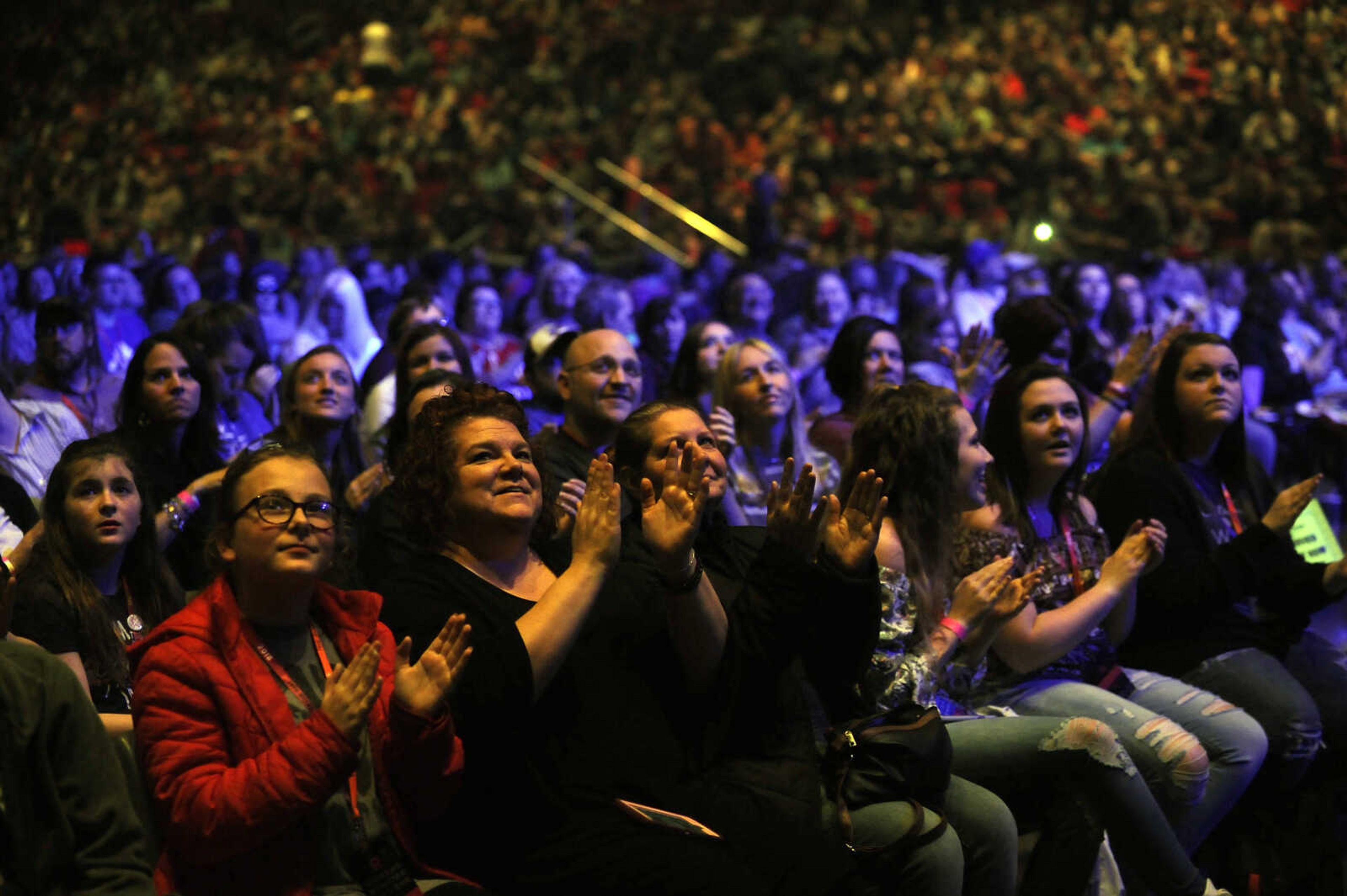 Concert goers clap along before the first act of The Roadshow on Thursday, Feb. 22, 2018, at the Show Me Center in Cape Girardeau.