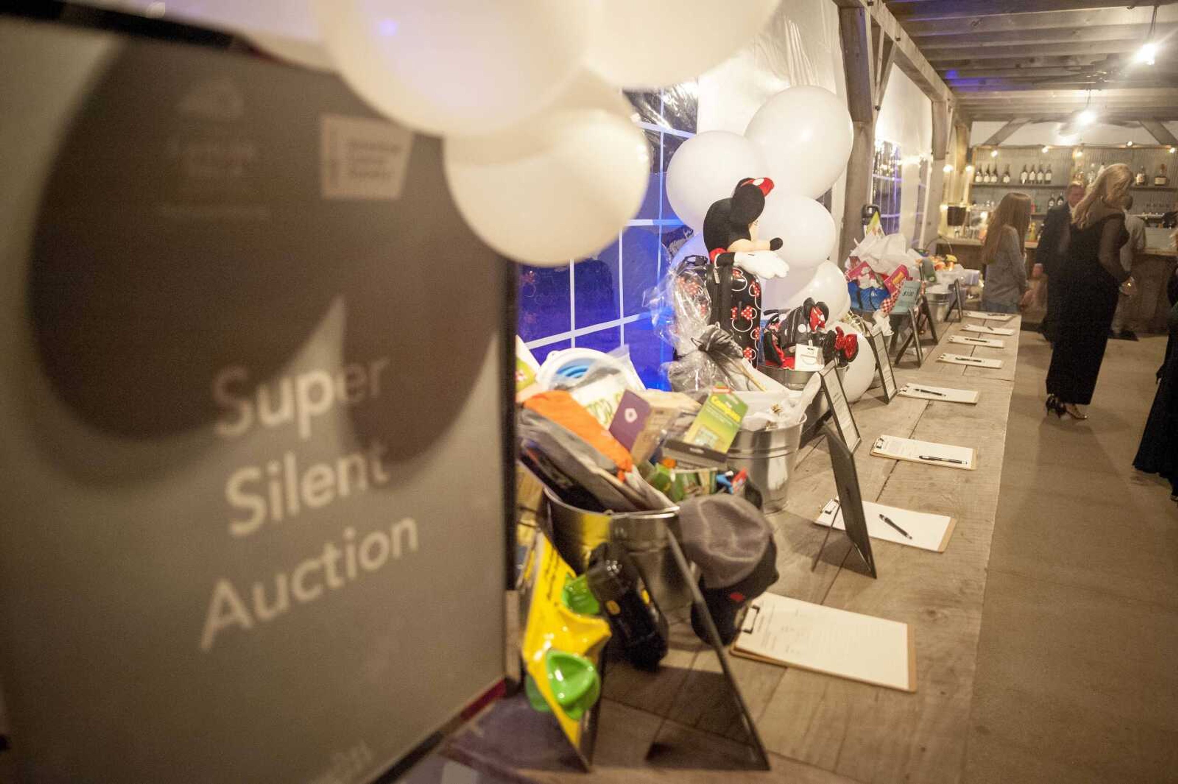 Silent auction items are seen during a fundraising gala for the American Cancer Society at Rusted Route Farms Saturday, Nov. 16, 2019, in Cape Girardeau.