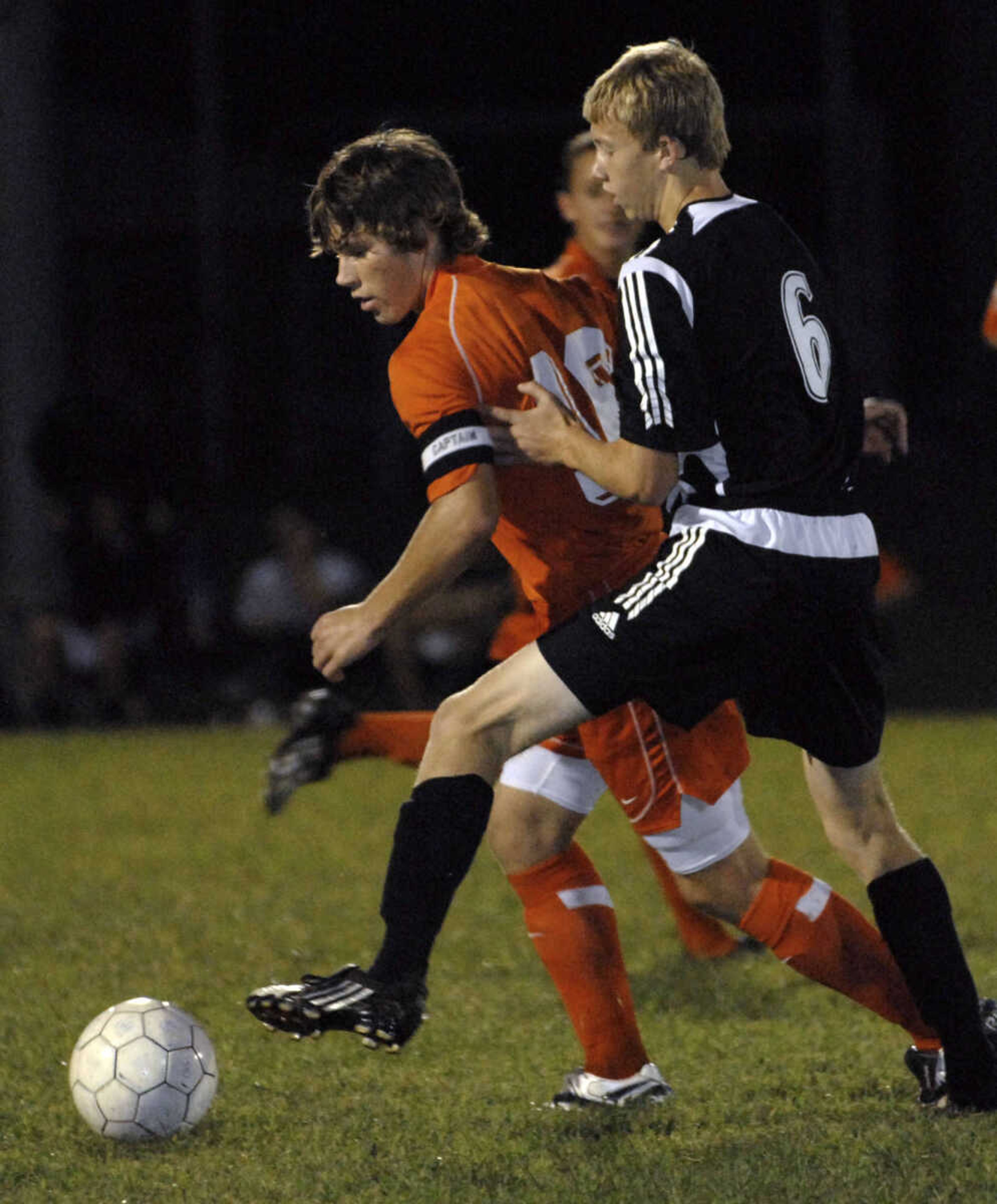 FRED LYNCH ~ flynch@semissourian.com
Central's Erik Allen keeps the ball away from Jackson's Ryan Schlick during first half Tuesday at Central.