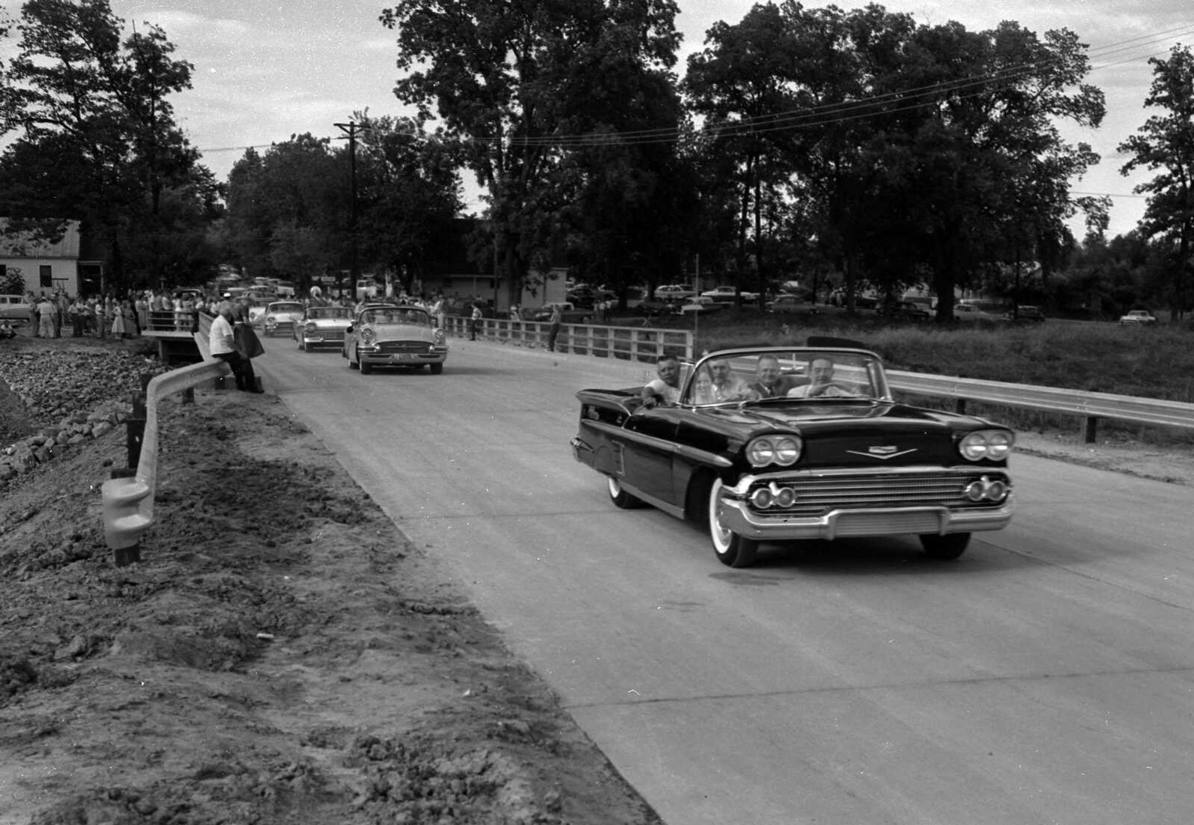 This was likely the first car to cross the new bridge over Sloan's Creek in 1958. It appears Mayor Walter Ford is a passenger in the car. Can anyone identify the other occupants?