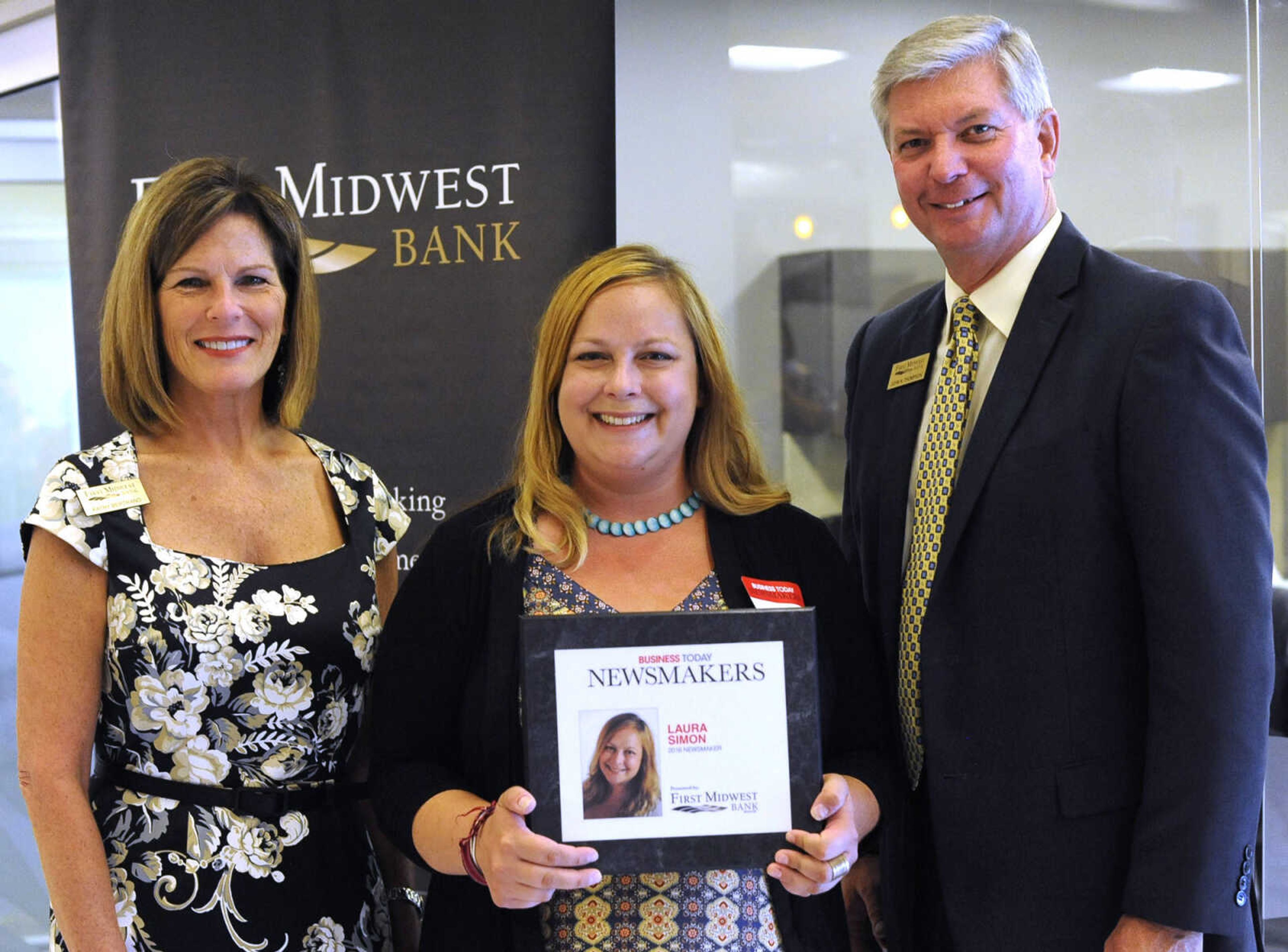 Laura Simon poses for a photo with Kathy Bertrand, First Midwest Bank community bank president, Cape Girardeau, and John N. Thompson, First Midwest Bank community bank president, Jackson, Wednesday, Sept. 7, 2016 during the Business Today Newsmakers awards reception at First Midwest Bank in Cape Girardeau.