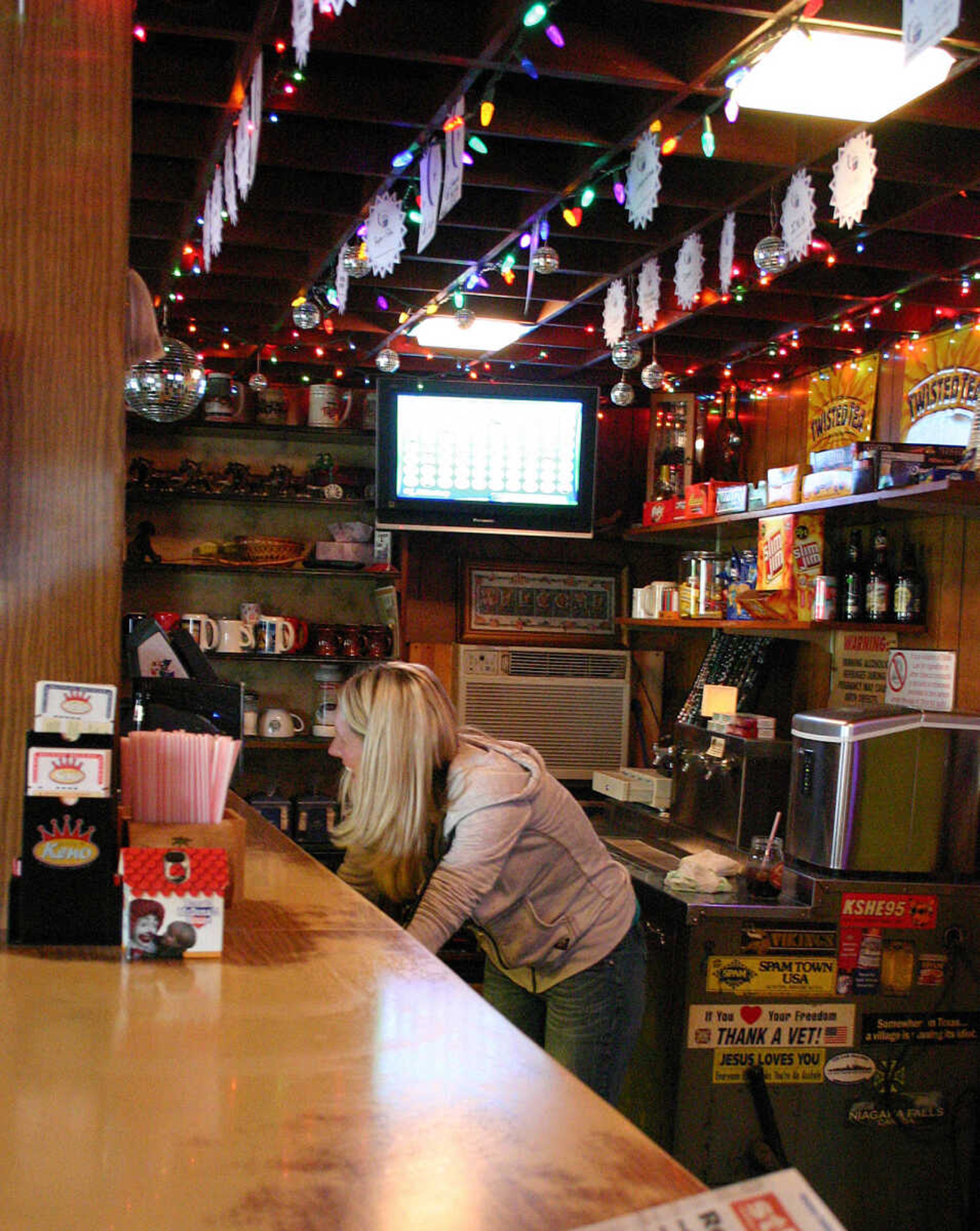 EMILY PRIDDY
Jennifer Ditch tends bar at the Dew Drop Inn on U.S. 61 in Bloomsdale. The tavern is located in a 1917 building.