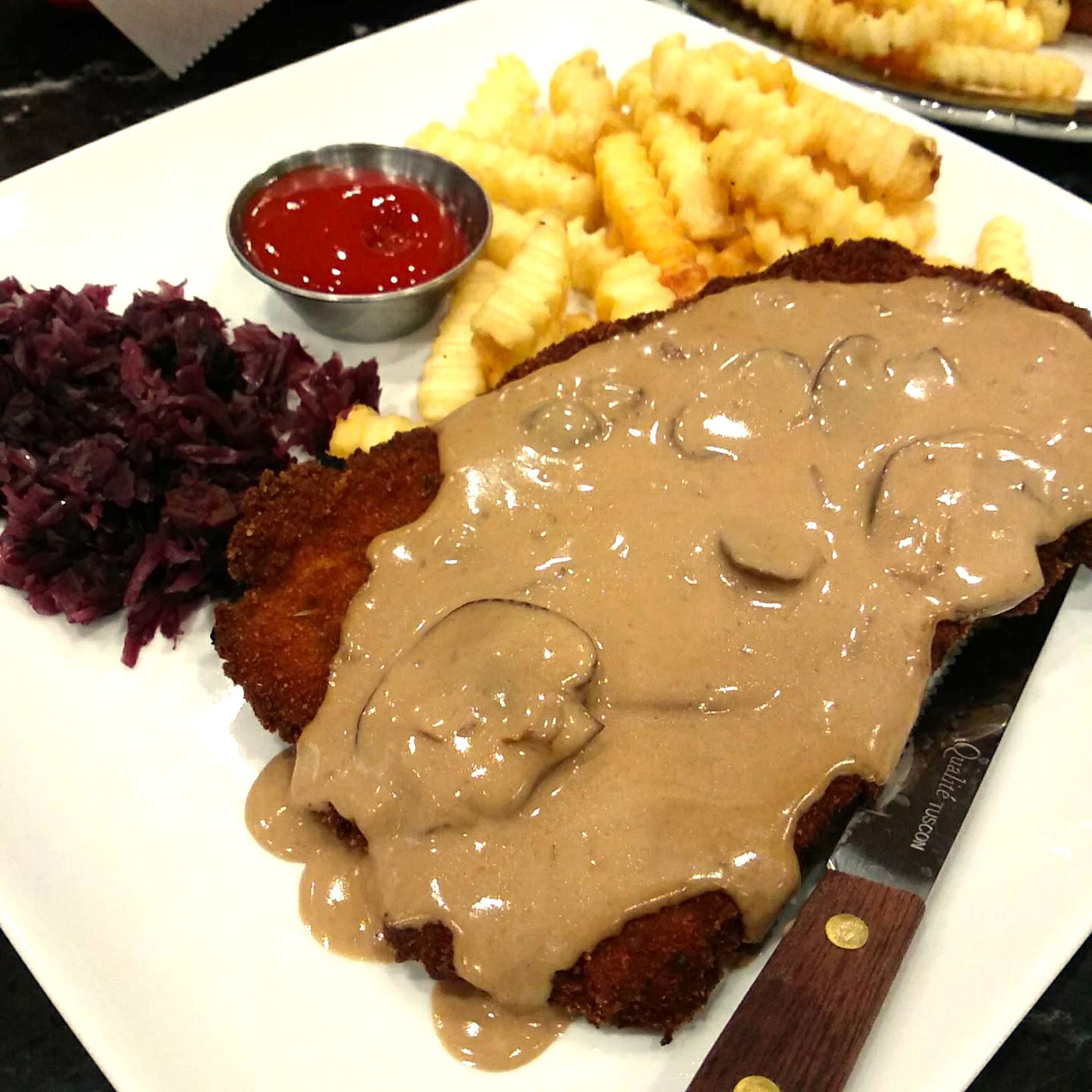 The Jager Schnitzel, covered in rich mushroom gravy. Don't discount that cabbage. Combined, the flavors are amazing.
