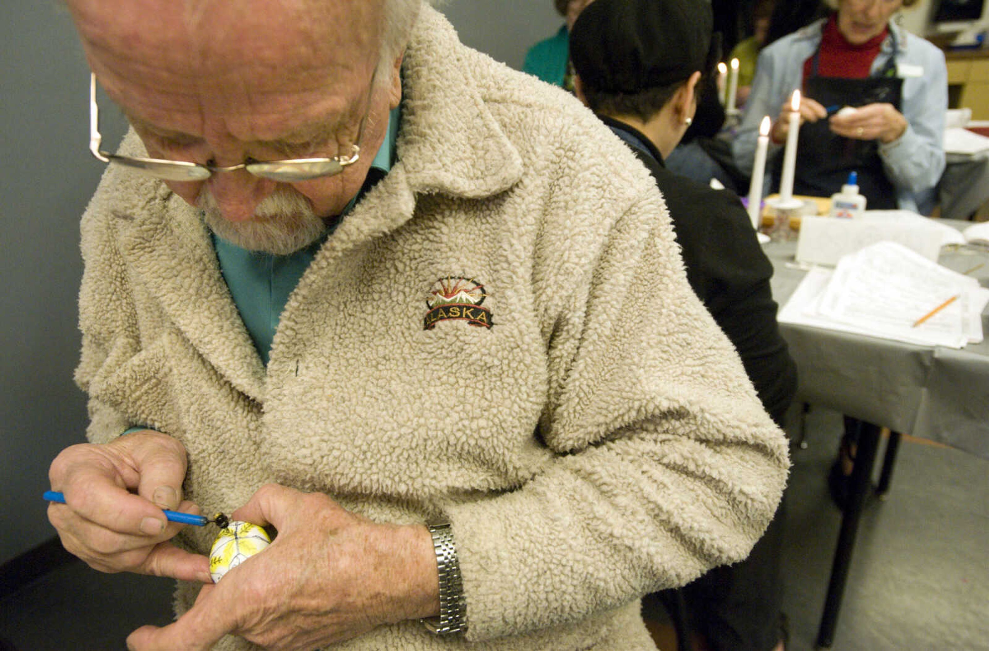 LAURA SIMON ~ lsimon@semissourian.com
Bernard Letassy applies a layer of beeswax to his egg Tuesday, March 19, 2013 during the Wonderful World of Pysanky workshop at Southeast Missouri State University's River Campus.