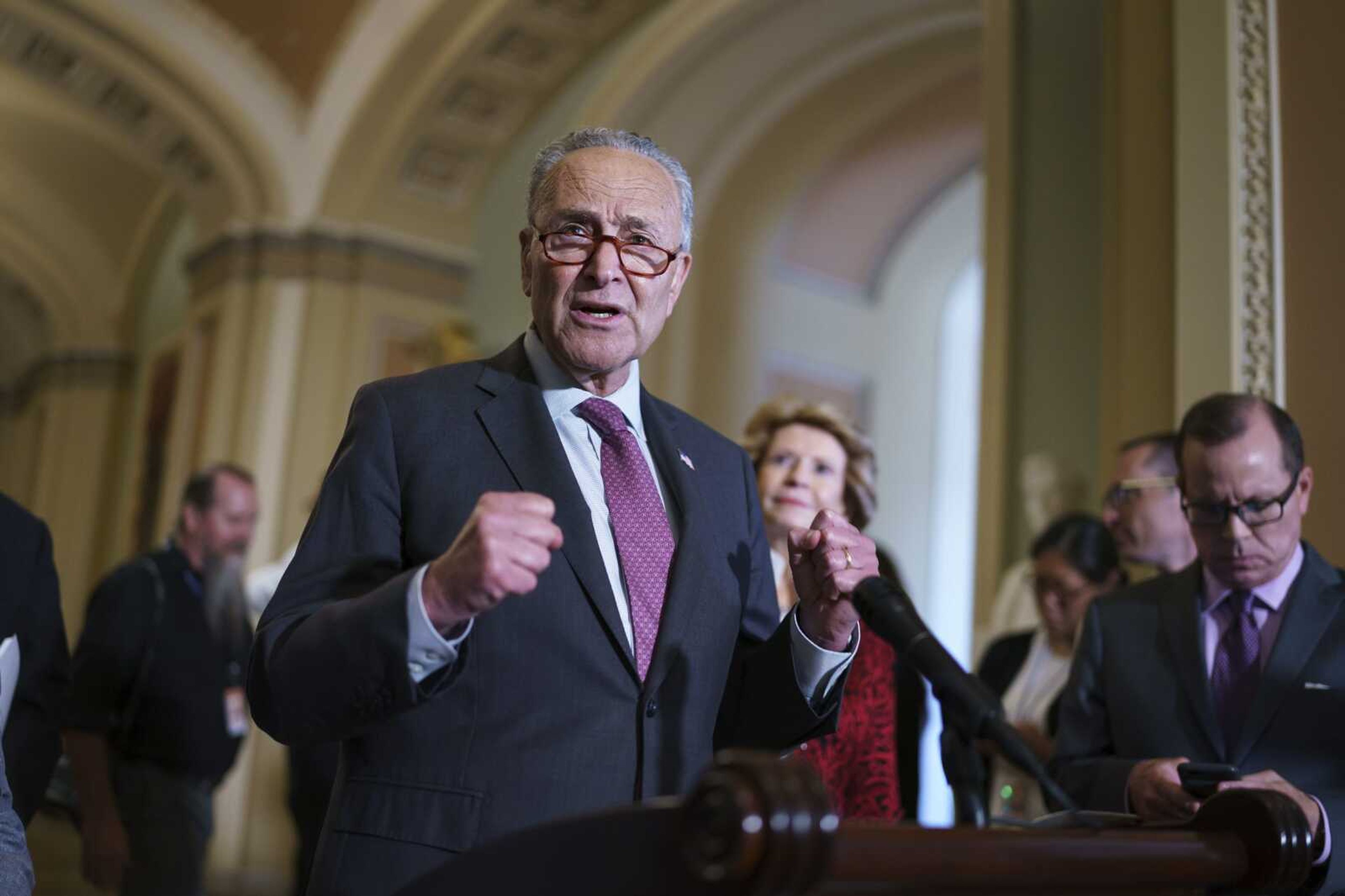 Senate Majority Leader Chuck Schumer, D-N.Y., speaks to reporters Tuesday at the Capitol in Washington.