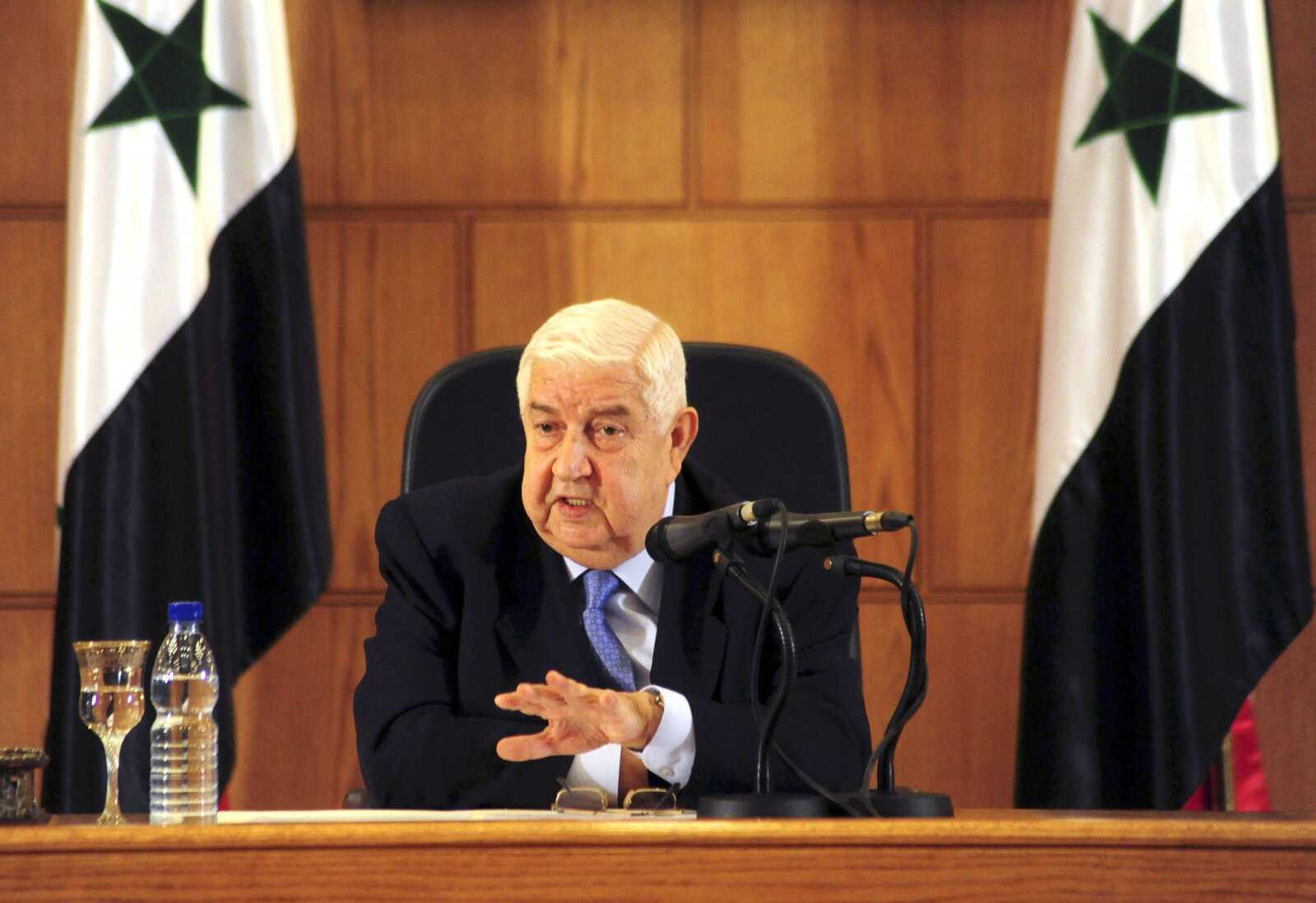 Syrian Foreign Minister Walid al-Moallem speaks during a news conference giving the first public comments by a senior Assad official on the threat posed by the Islamic State group Monday in Damascus, Syria. (SANA)