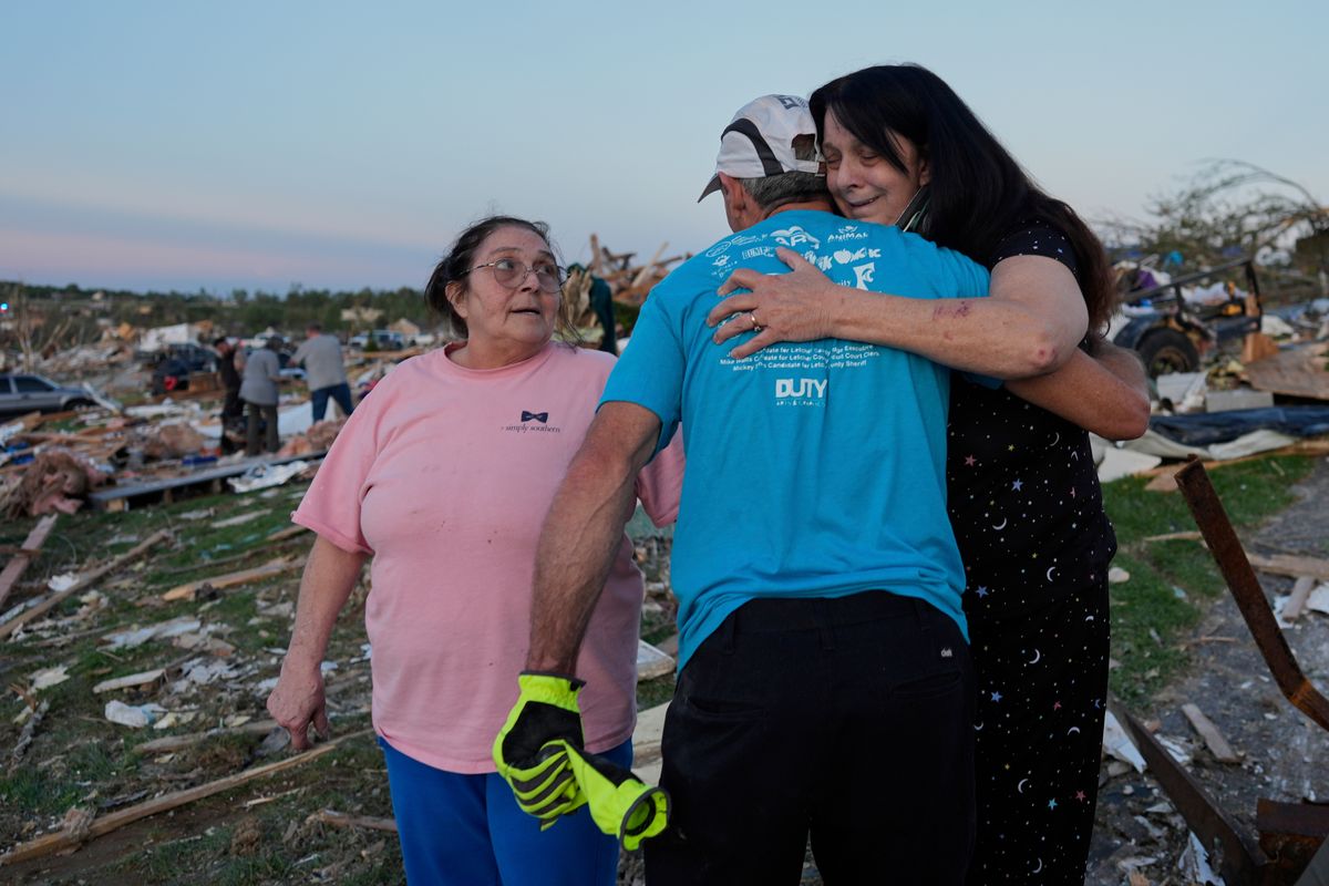 Residents dig out from tornado damage after storms kill 27 i...
